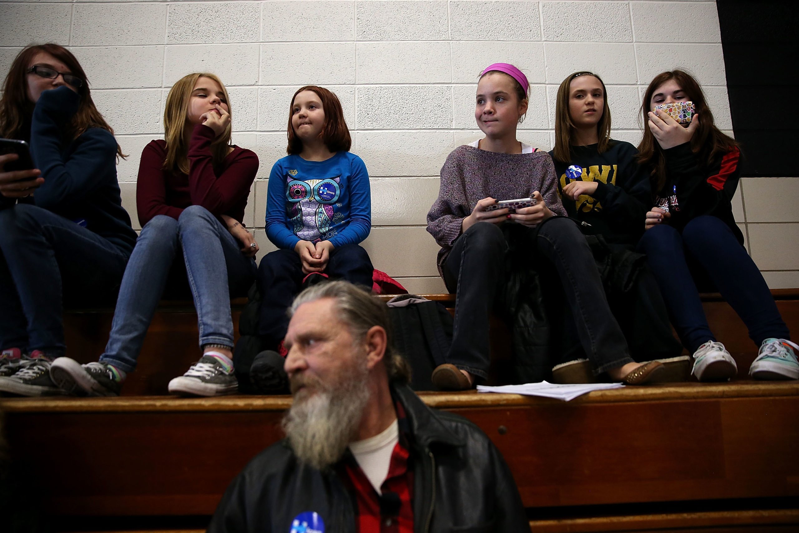 Berg Middle School students wait for Democratic presidential candidate, former Secretary of State Hillary Clinton to take the stage during a "get out the caucus" event at Berg Middle School on January 28, 2016 in Newton, Iowa. With less than a week to go before the Iowa caucuses, Hillary Clinton is campaigning throughout Iowa. (Photo by Justin Sullivan/Getty Images)