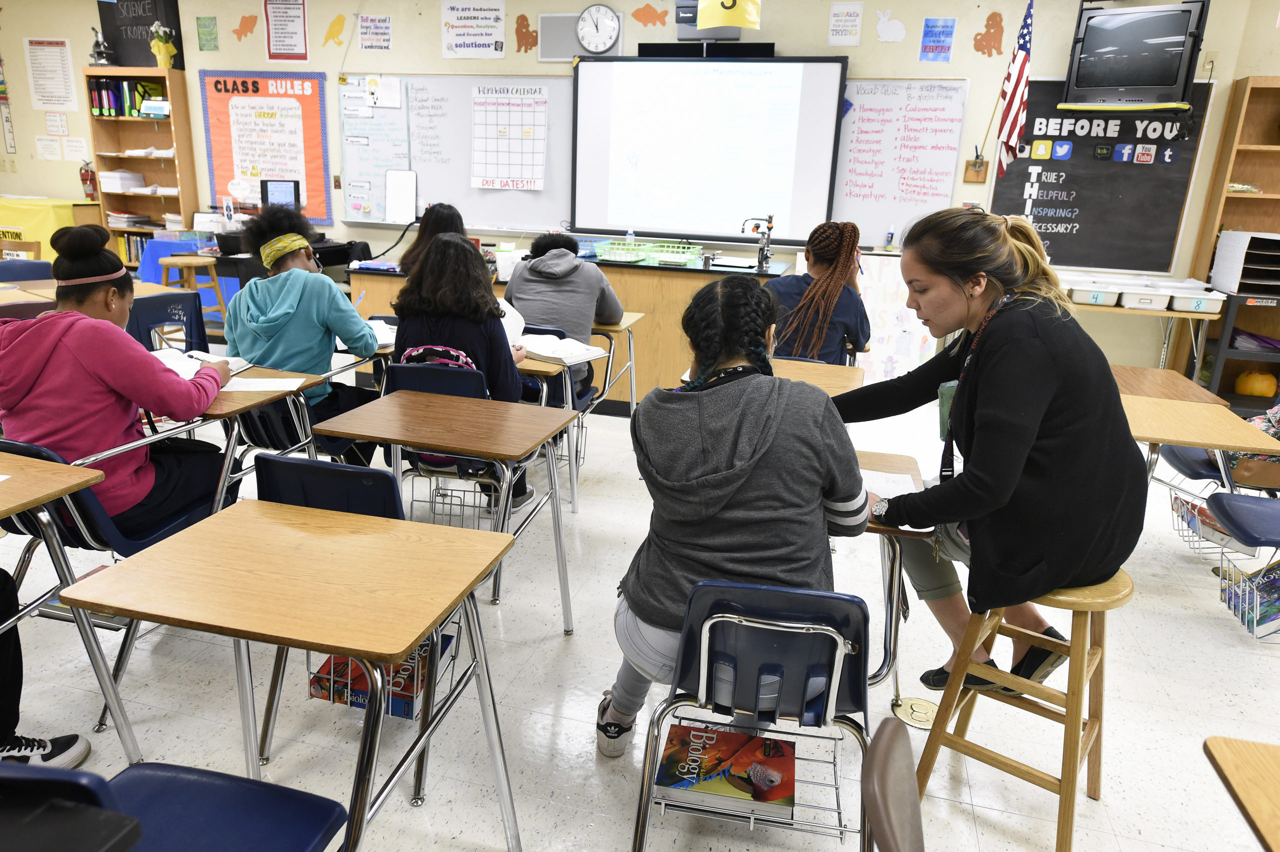 Science teacher Virginia Escobar-Cheng works with her students in a science class in a high school in Homestead, Florida, on March 10, 2017. Texas state legislators are now considering a bill introduced in February that would offer teachers like Garlington some legal protection, by giving them latitude to present science "that may cause controversy" as a debatable theory. Texas is one of eight US states where such laws have been proposed since the beginning of the year. South Dakota, Oklahoma, Iowa, Alabama, Indiana, Florida and Arkansas are the others. / AFP PHOTO / RHONA WISE / The erroneous mention[s] appearing in the metadata of this photo by RHONA WISE has been modified in AFP systems in the following manner: [March 10, 2017 instead of [March 10, 2010]. Please immediately remove the erroneous mention[s] from all your online services and delete it (them) from your servers. If you have been authorized by AFP to distribute it (them) to third parties, please ensure that the same actions are carried out by them. Failure to promptly comply with these instructions will entail liability on your part for any continued or post notification usage. Therefore we thank you very much for all your attention and prompt action. We are sorry for the inconvenience this notification may cause and remain at your disposal for any further information you may require. (Photo credit should read RHONA WISE/AFP via Getty Images)