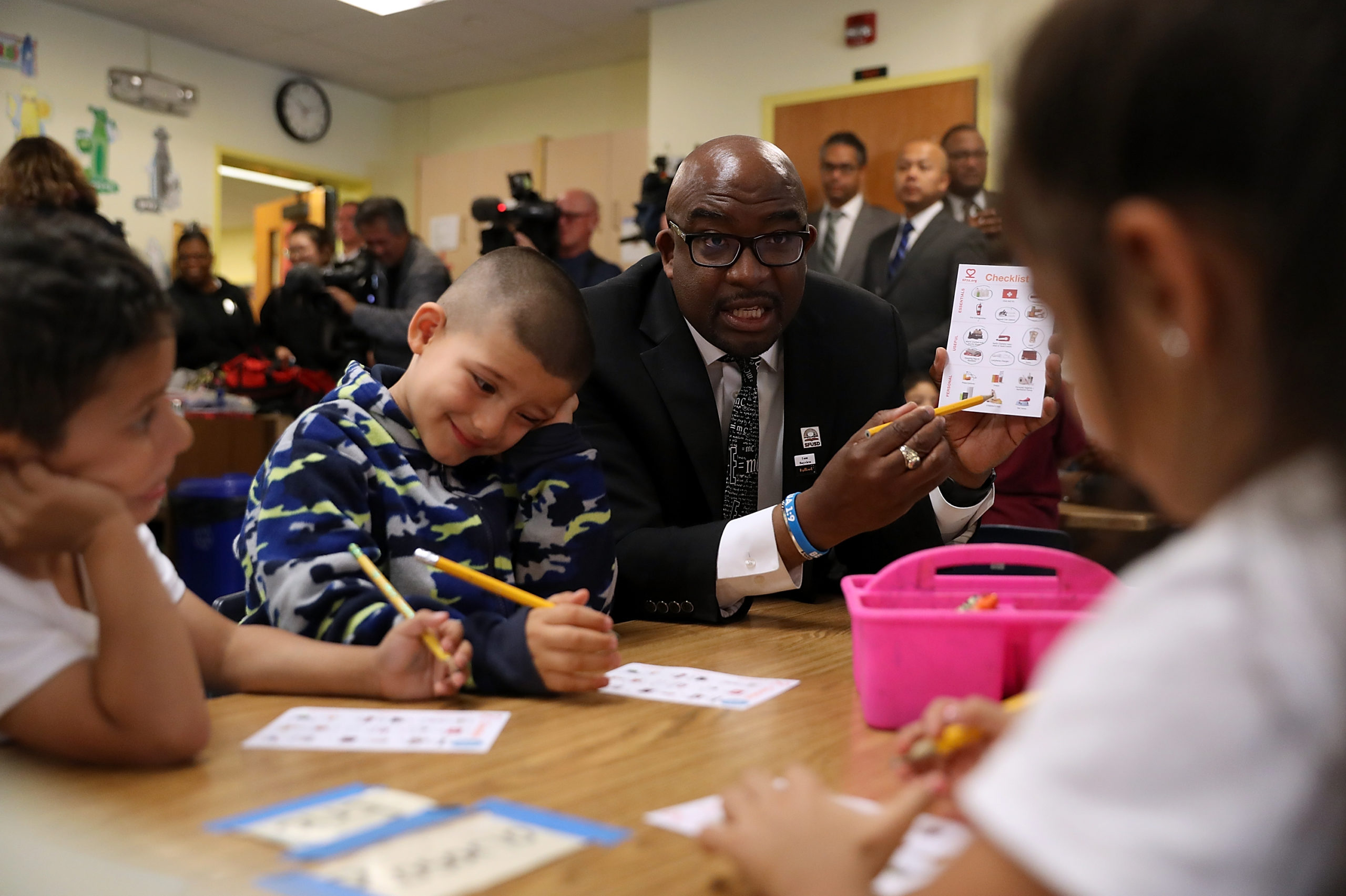 San Francisco Unified School District superintendent Dr. Vincent Matthews (C) reviews supplies that are needed after an earthquake occurs with students at Bryant Elementary School during a Great ShakeOut event on October 18, 2018 in San Francisco, California. Millions of people around the world participated in Great ShakeOut Earthquake drills to practice how to drop, cover and hold on in the event of an earthquake. (Photo by Justin Sullivan/Getty Images)