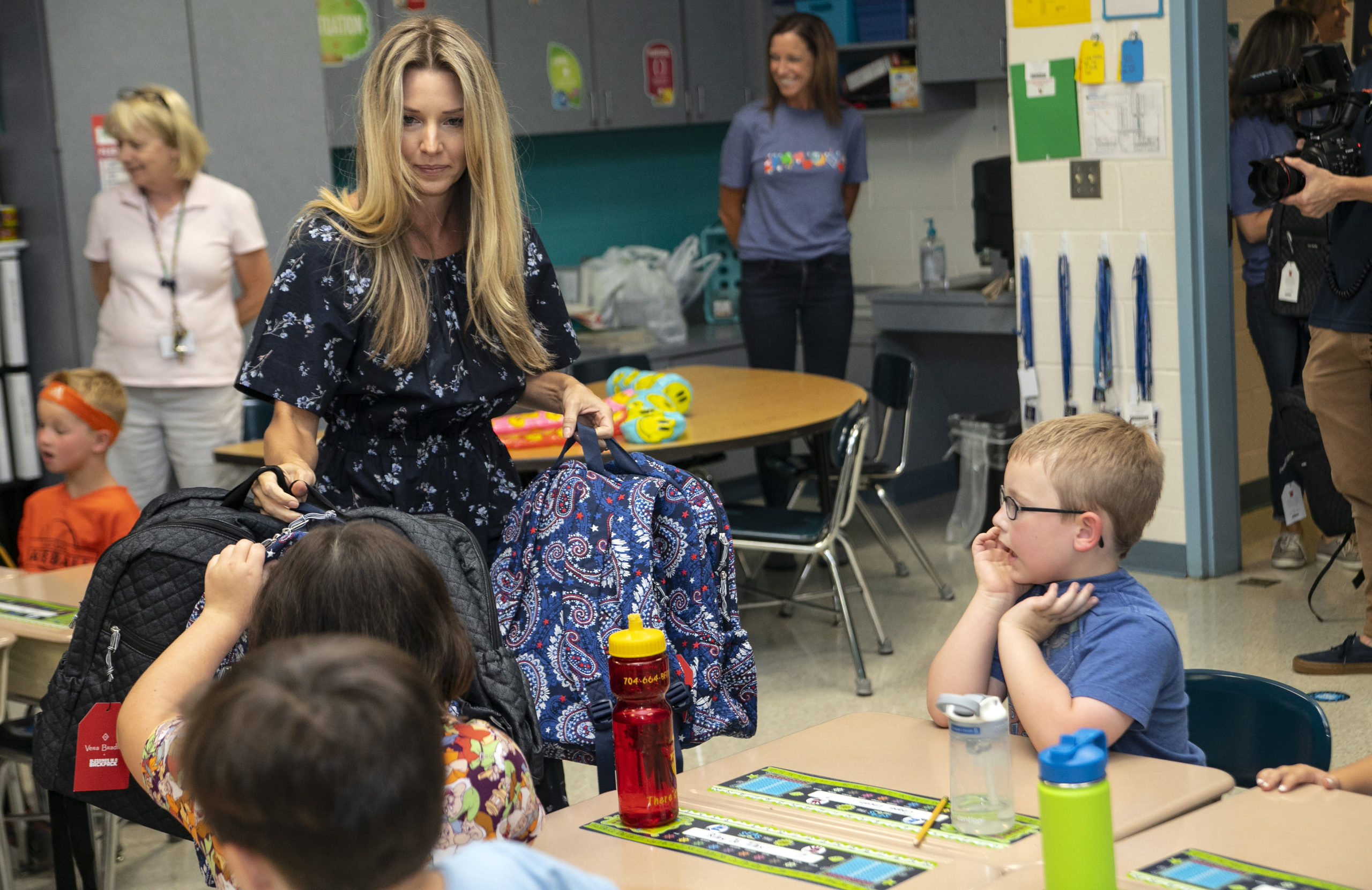 Amy Earnhardt surprises students for the Vera Bradley x Blessings In A Backpack Event at Shepherd Elementary on September 16, 2019 in Mooresville, North Carolina. (Photo by Jeff Hahne/Getty Images for Vera Bradley)