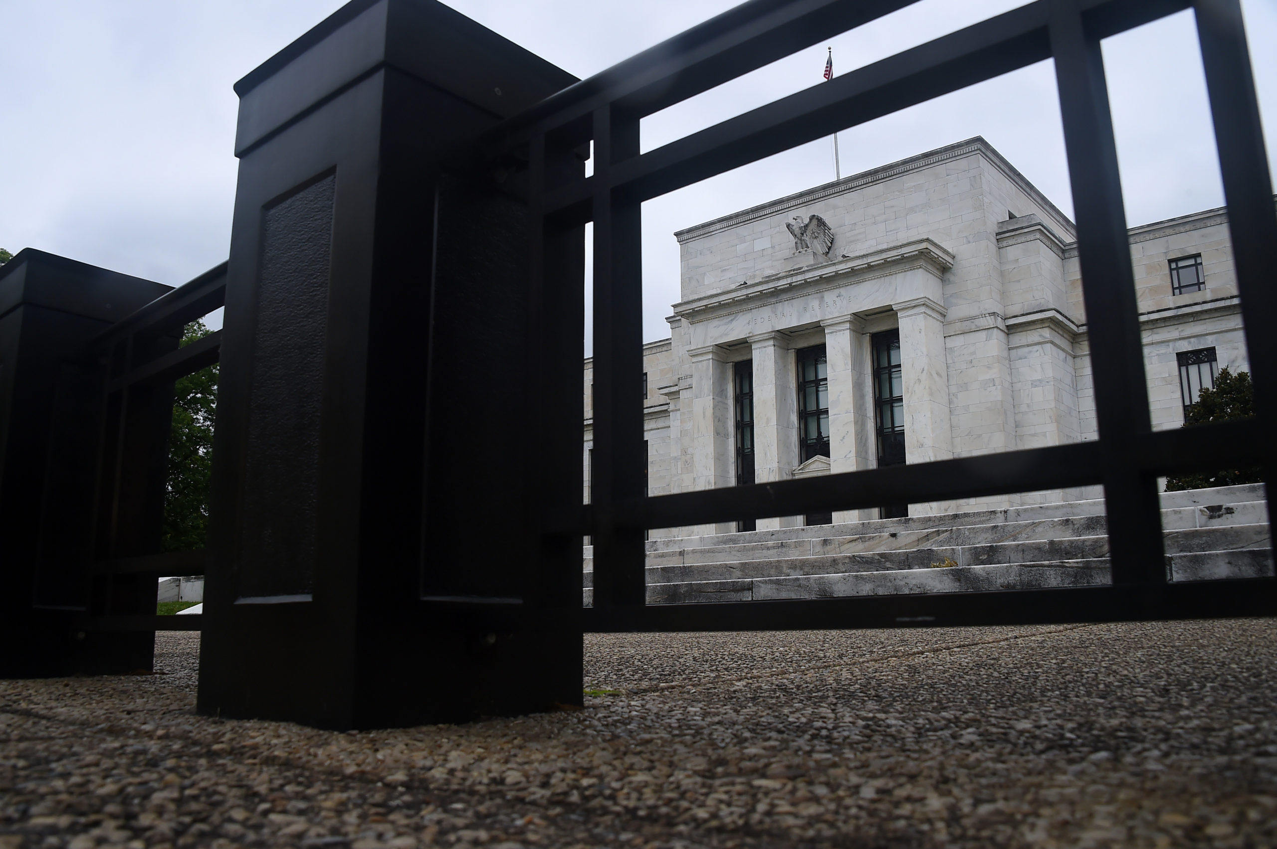 The Federal Reserve Building is seen through a fence on June 17, 2020 in Washington, DC. (Photo by Olivier DOULIERY / AFP) (Photo by OLIVIER DOULIERY/AFP via Getty Images)