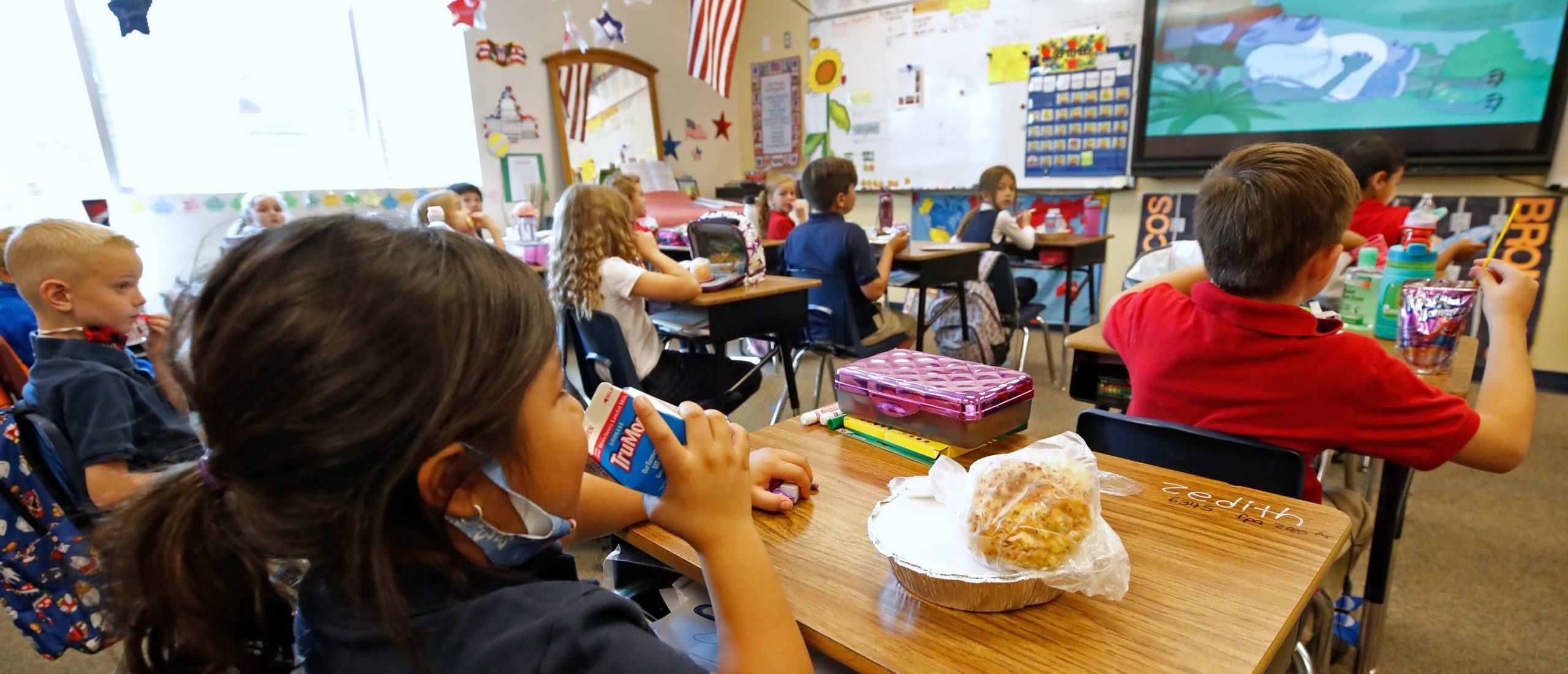 A student eats lunch in her classroom at Freedom Preparatory Academy on September 10, 2020 in Provo, Utah. - In person schooling with masks has started up in many Utah schools since shutting down in March of this year due to the covid-19 virus. (Photo by GEORGE FREY / AFP) (Photo by GEORGE FREY/AFP via Getty Images)