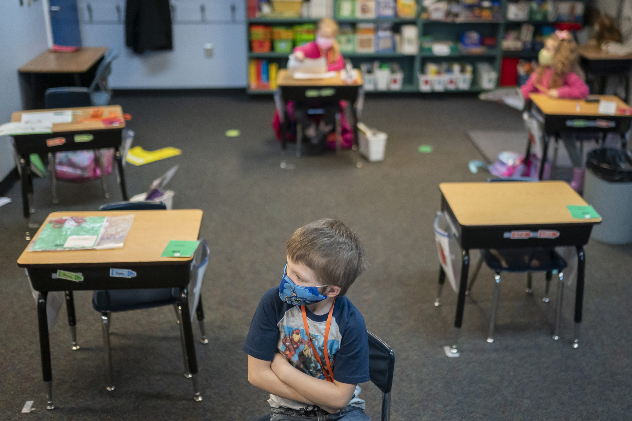 A first grade student at the Green Mountain School listens to his teacher on February 18, 2021 in Woodland, Washington. Washington state loosened in-person learning guidelines in December, sending elementary and middle school students back to the classroom a few days each week. (Photo by Nathan Howard/Getty Images)