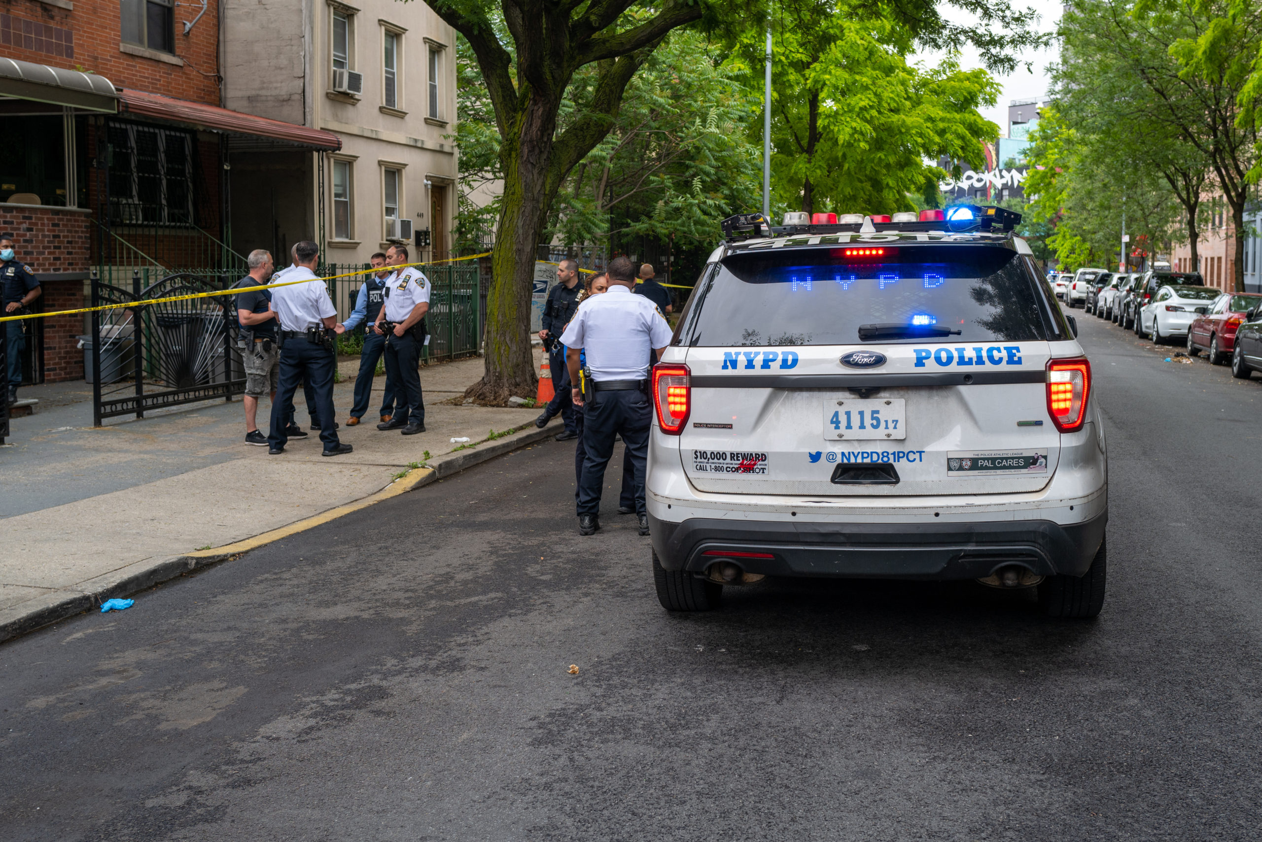 NEW YORK, NEW YORK - JUNE 16: Police gather at the scene of a shooting in Brooklyn that left one person dead on June 16, 2022 in New York City. While much of the nation has witnessed a rise in gun violence over the last year, police are anticipating a surge in shootings over the coming summer months. According to NYPD statistics, a total of 656 people have been shot in 559 incidents so far this year. (Photo By Spencer Platt/Getty Images)