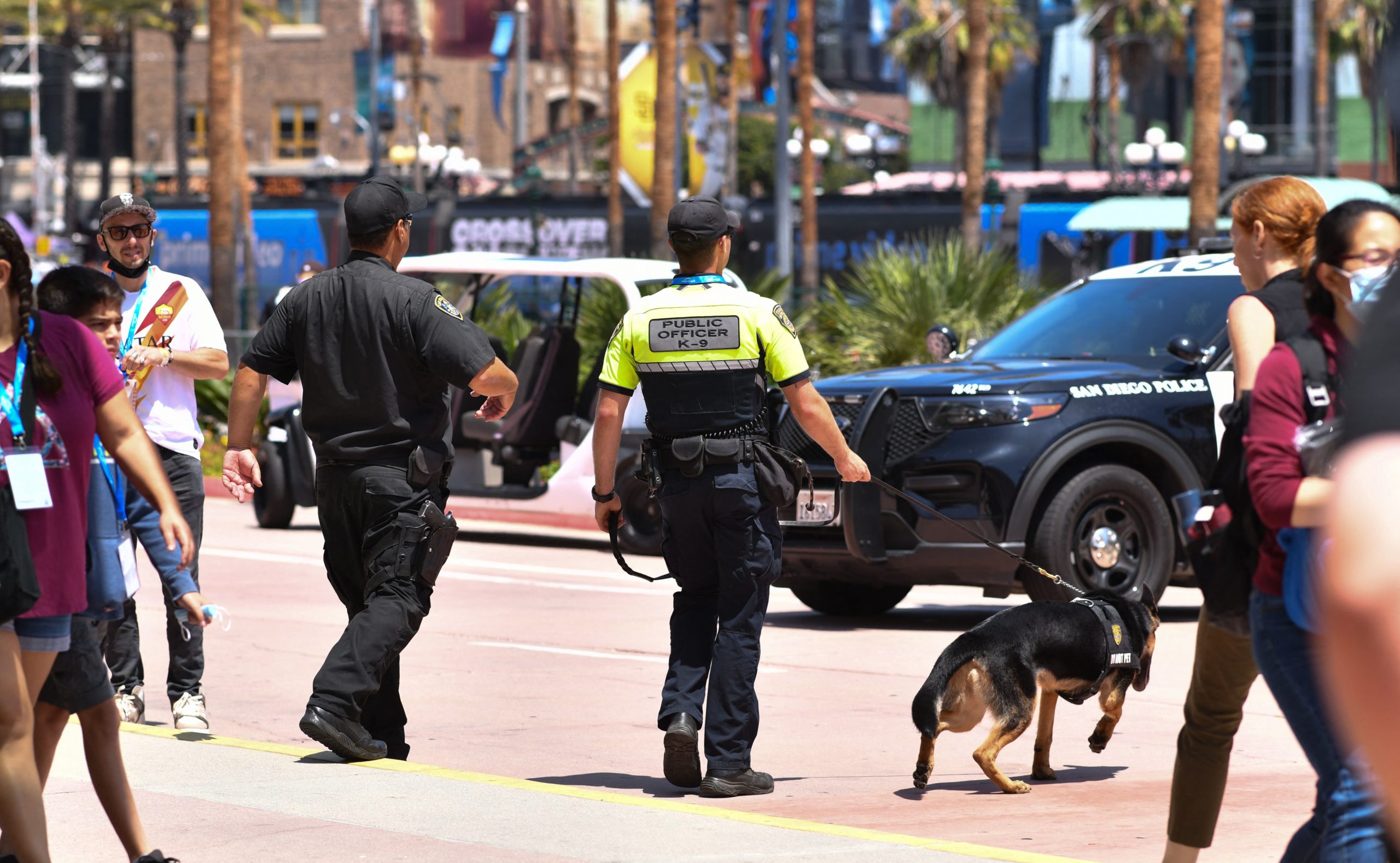 Police officers from the K-9 unit patrol in front of the convention center during San Diego Comic-Con International in San Diego, California, on July 24, 2022. (Photo by Chris Delmas / AFP) (Photo by CHRIS DELMAS/AFP via Getty Images)