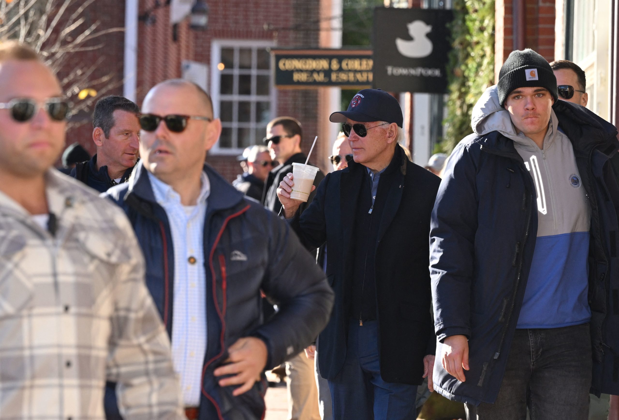 US President Joe Biden (C) shops in Nantucket, Massachusetts, on November 26, 2022, during the observance of Small Business Saturday. (Photo by MANDEL NGAN/AFP via Getty Images)