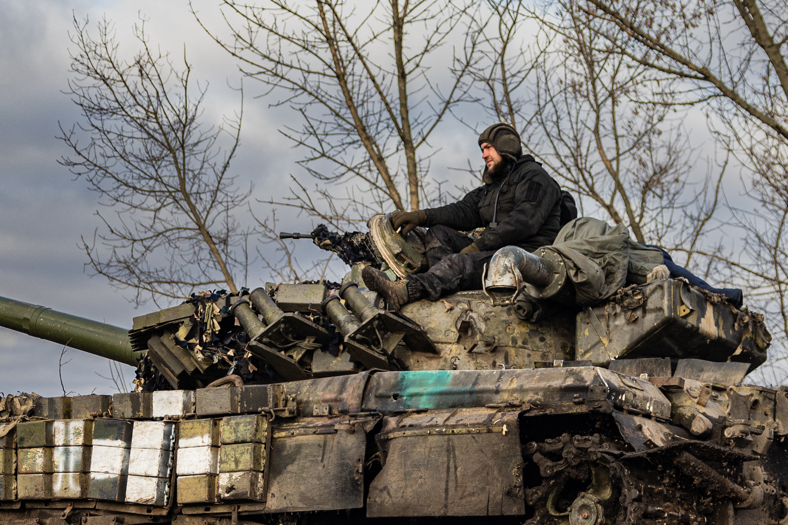 A Ukrainian serviceman sits on a tank T-72 near Bakhmut, eastern Ukraine on December 22, 2022.