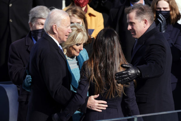 WASHINGTON, DC - JANUARY 20: U.S. President Joe Biden hugs his wife Dr. Jill Biden, son Hunter Biden and daughter Ashley Biden after being sworn in as U.S. president during his inauguration on the West Front of the U.S. Capitol on January 20, 2021 in Washington, DC. During today's inauguration ceremony Joe Biden becomes the 46th president of the United States. (Photo by Alex Wong/Getty Images)