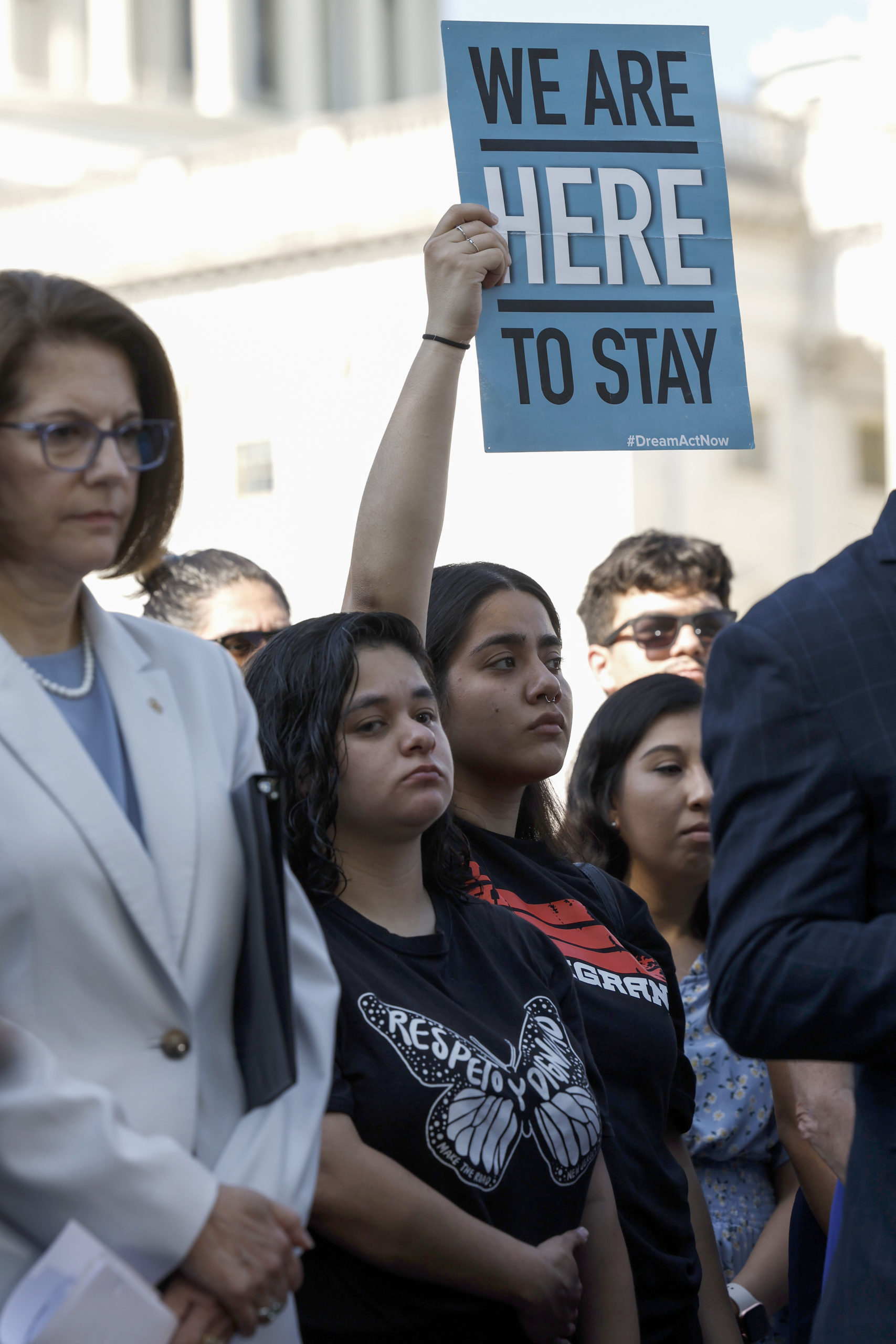 Activists carry signs as they listen to speakers at a news conference to mark the 10th anniversary of the "Deferred Action for Childhood Arrivals" (DACA) at the U.S. Capitol on June 15, 2022 in Washington, DC. 