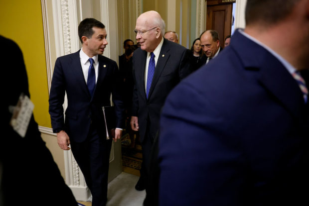 WASHINGTON, DC - DECEMBER 01: U.S. Transportation Secretary Pete Buttigieg (L) talks with Senate Appropriations Committee Chairman Patrick Leahy (D-VT) as they arrive for a closed-door policy luncheon with Senate Democrats at the U.S. Capitol on December 01, 2022 in Washington, DC. Buttigieg and Labor Secretary Marty Walsh are meeting with the senators to encourage them to pass legislation to avert a nationwide railroad workers strike. (Photo by Chip Somodevilla/Getty Images)