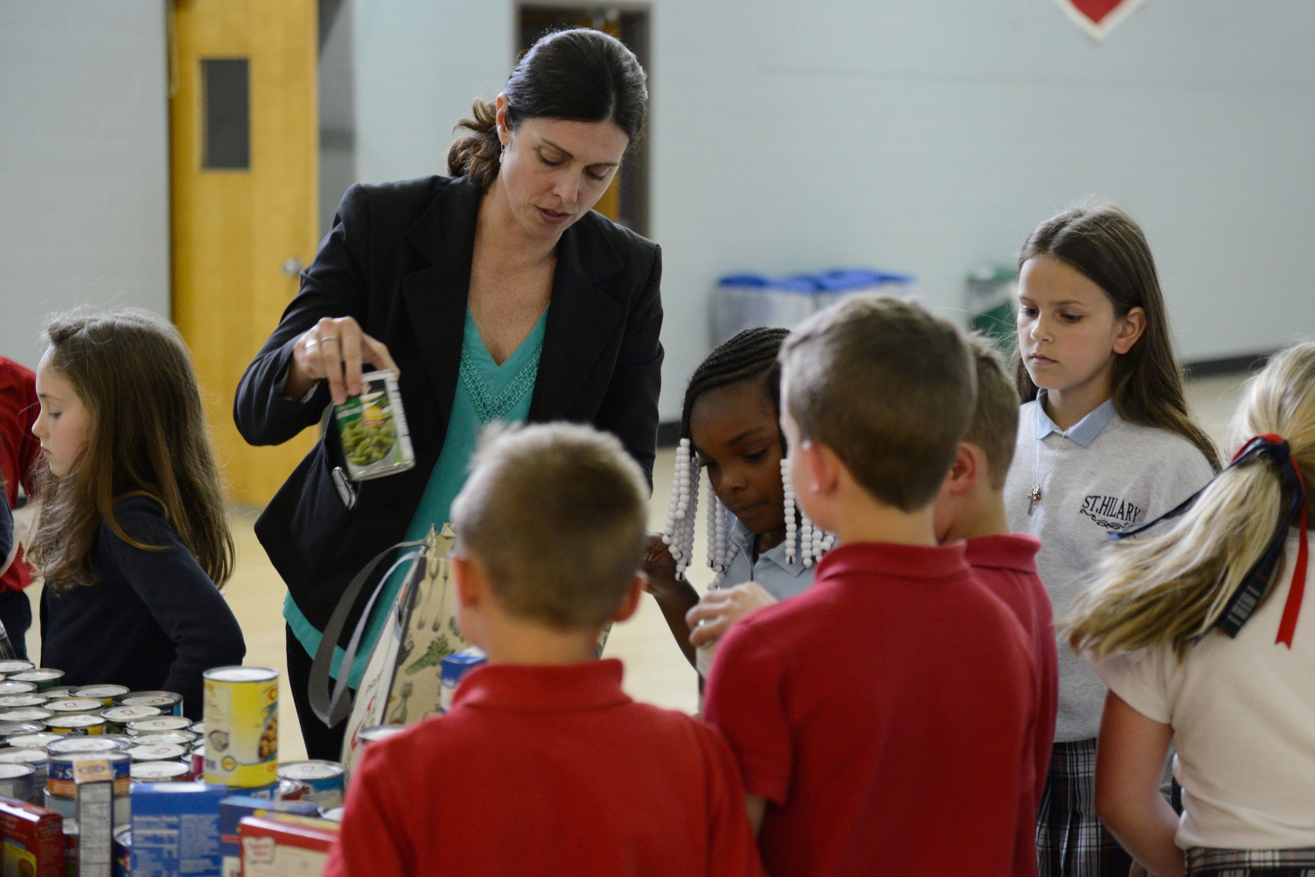  Shelly Hinton, Vice President of Akron-Canton Regional Food Bank, speaks to students at Saint Hillary School about the Hungry To Help Lesson Plan on May 24, 2017 in Fairlawn, Ohio. (Photo by Duane Prokop/Getty Images for Feeding America)