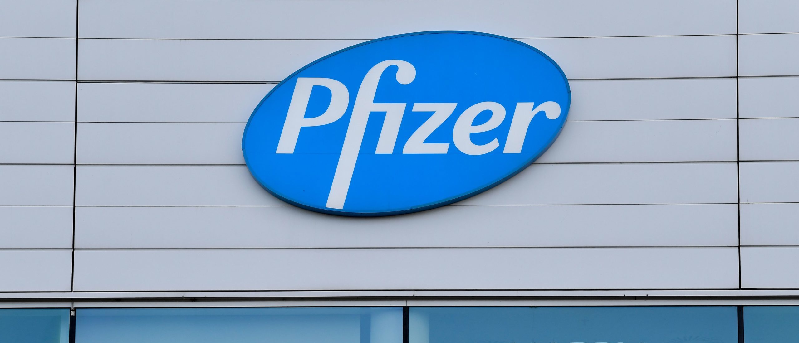 This photograph taken on December 22, 2020 in Puurs shows the logo of US multinational pharmaceutical company Pfizer at the production site of the Covid-19 vaccine that was given the European Union's green light the day before, paving the way for vaccinations to finally start in the 27-nation bloc on December 27. (Photo by JOHN THYS / AFP) (Photo by JOHN THYS/AFP via Getty Images)