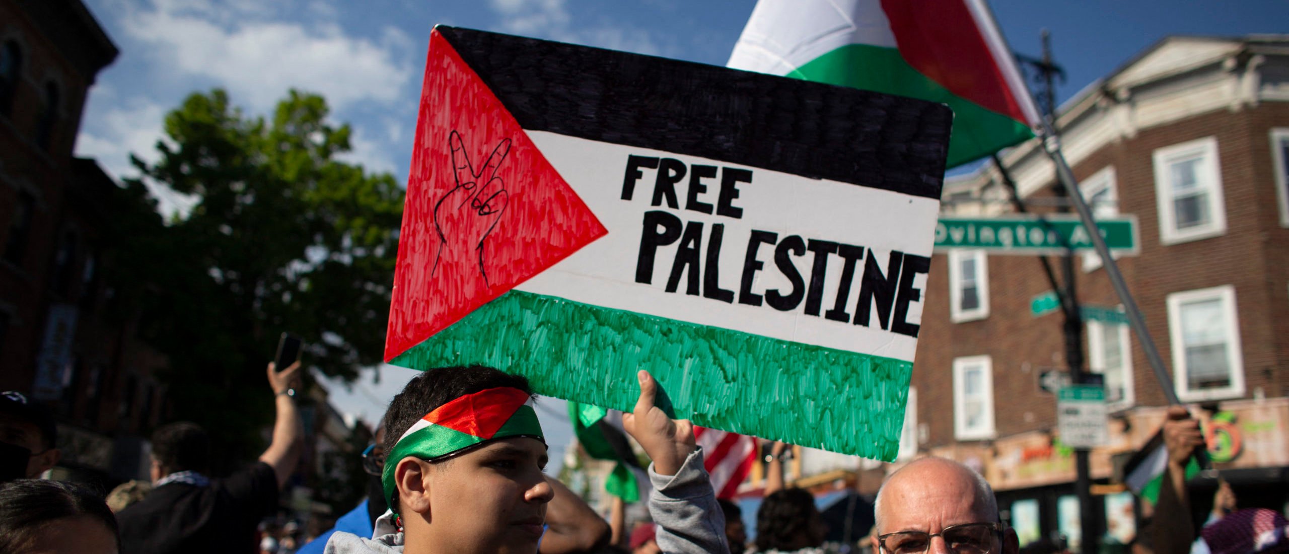 A man holds a "Free Palestine" sign during a demonstration in support of Palestine in Brooklyn, New York on May 15, 2021.