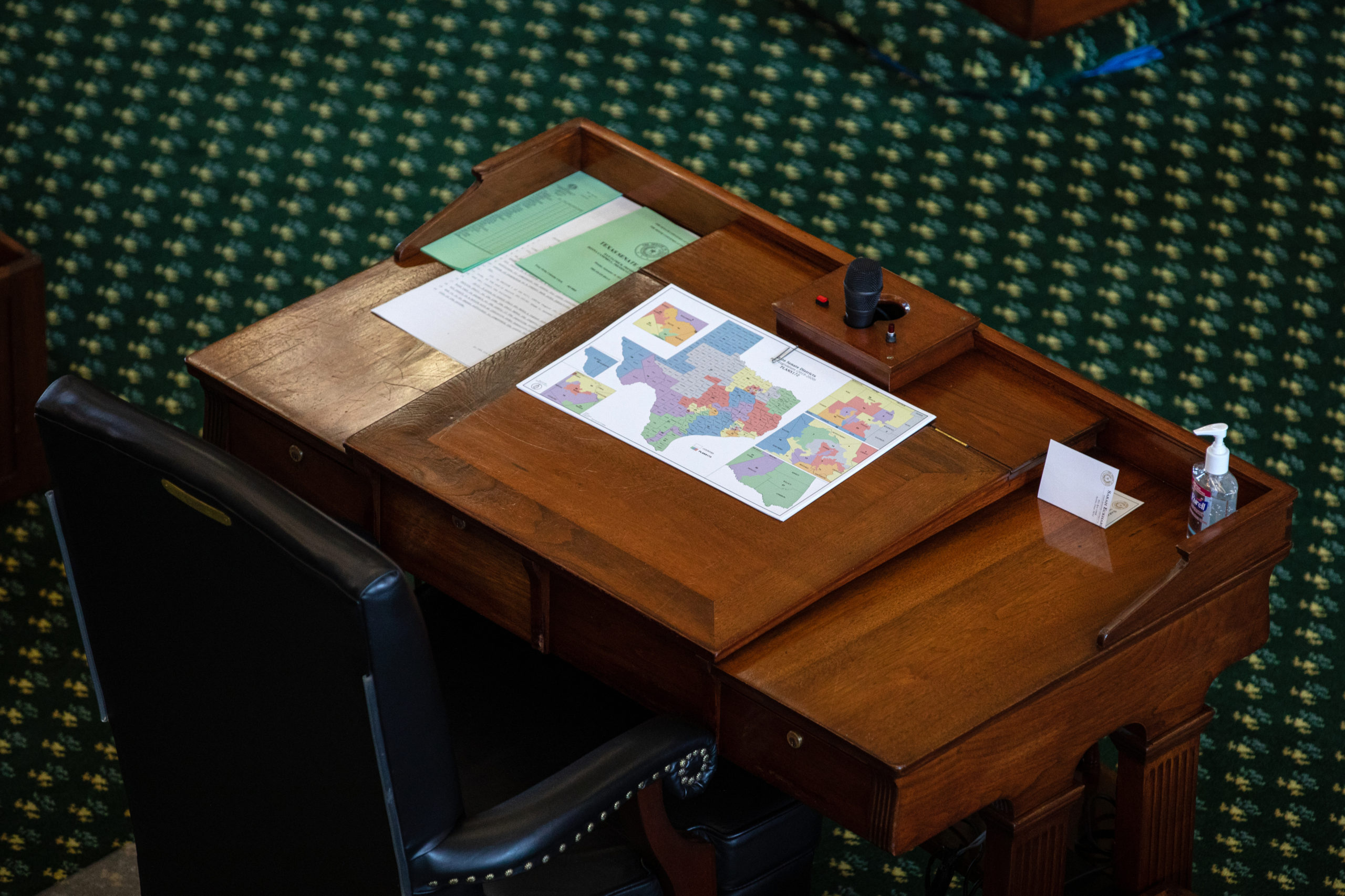 A map of state Senate districts is seen on a desk in the Senate chamber on the first day of the 87th Legislature's third special session at the State Capitol on September 20, 2021 in Austin, Texas. 
