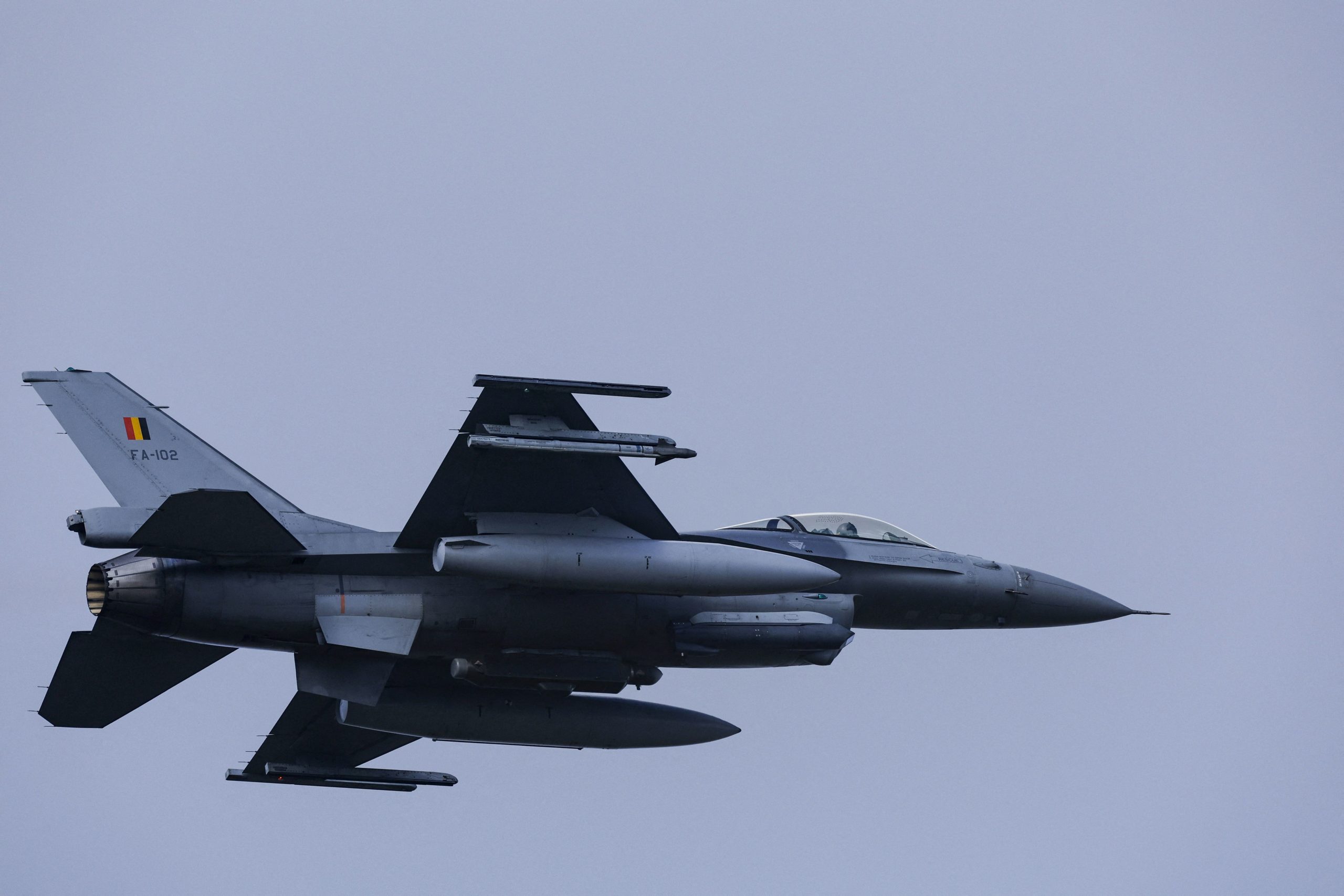 A Belgian F-16 jet fighter takes part in the NATO Air Nuclear drill "Steadfast Noon" (its regular nuclear deterrence exercise) at the Kleine-Brogel air base in Belgium on October 18, 2022. - NATO on October 17, 2022 launched its regular nuclear deterrence drills in western Europe, after tensions soared with Russia over President Vladimir Putin's veiled threats in the face of setbacks in Ukraine. The 30-nation alliance has stressed that the "routine, recurring training activity" -- which runs until October 30 -- was planned before Moscow invaded Ukraine and is not linked to the current situation.