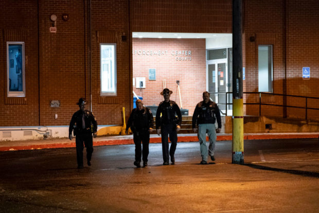 MOSCOW, ID - JANUARY 4: Law enforcement personnel keep watch shortly before a convoy, believed to be carrying murder suspect Bryan Kohberger, entered the Latah County Courthouse on January 4, 2023 in Moscow, Idaho. Kohberger has been arrested for the murders of four University of Idaho students. (Photo by David Ryder/Getty Images)