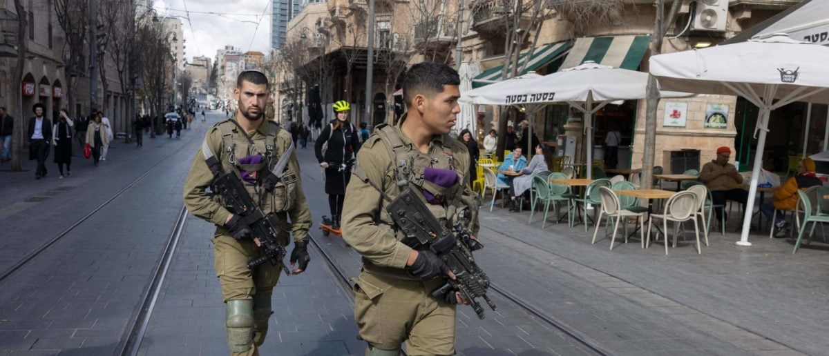 Israeli soldiers patrol the center of Jerusalem on January 30, 2023 as the authorities intensified security measures following last week's shooting attack by a Palestinian man who killed seven people near a synagogue in the Israeli-annexed eastern sector of the city. - The attack came a day after Israeli forces killed 10 Palestinians in the Jenin refugee camp, in the deadliest raid by Israeli forces in the West Bank in nearly two decades. (Photo by MENAHEM KAHANA / AFP) (Photo by MENAHEM KAHANA/AFP via Getty Images)