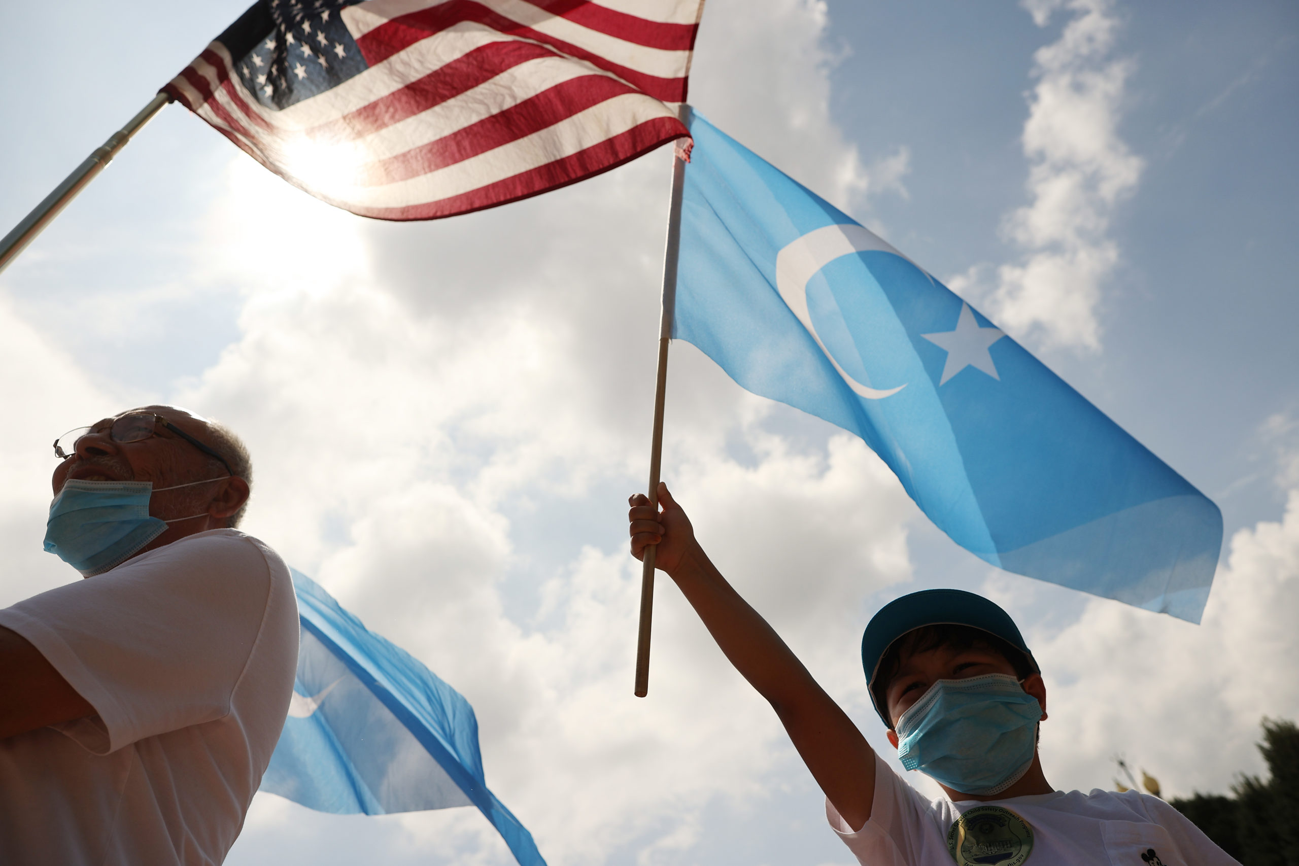 Supporters and members of the East Turkistan National Awakening Movement rally outside the White House to urge the United States to end trade deals with China and take action to stop the oppression of the Uyghur and other Turkic peoples August 14, 2020 in Washington, DC. 