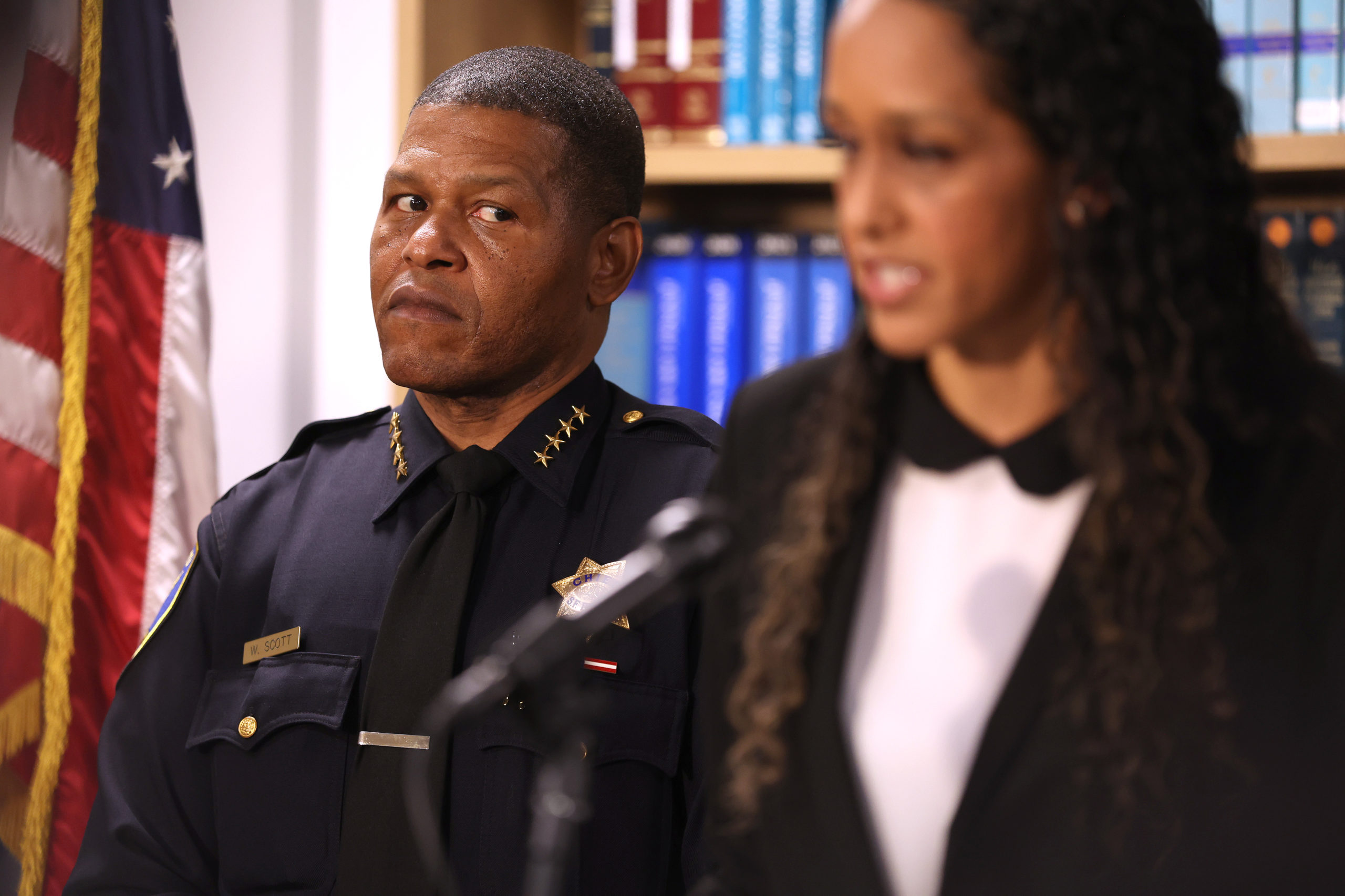 SAN FRANCISCO, CALIFORNIA - OCTOBER 31: San Francisco police chief Bill Scott (L) looks on as San Francisco district attorney Brooke Jenkins during a news conference on October 31, 2022 in San Francisco, California. (Photo by Justin Sullivan/Getty Images)