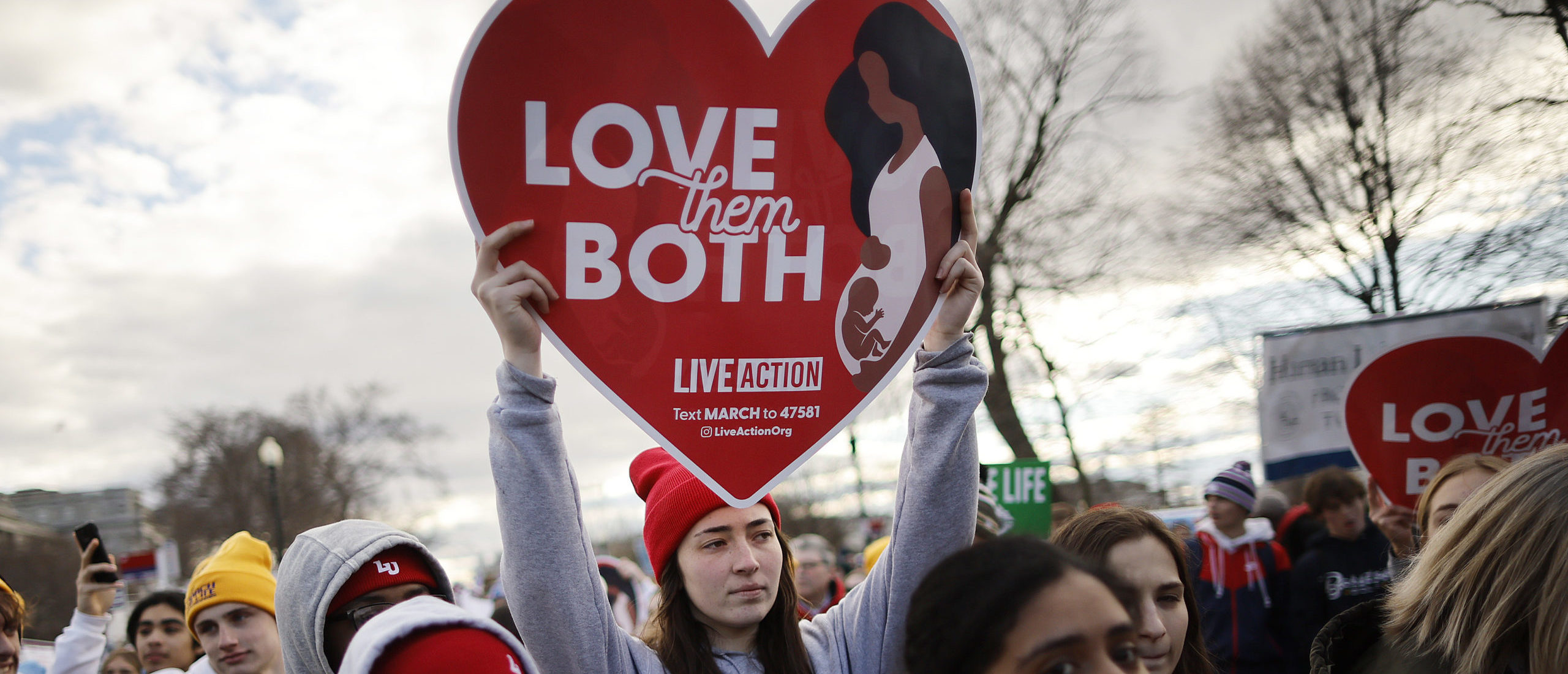 WASHINGTON, DC - JANUARY 20: People march past the U.S. Supreme Court during the 50th annual March for Life rally on January 20, 2023 in Washington, DC. Anti-abortion activists attended the annual march to mark the first to occur in a “post-Roe nation” since the Supreme Court's Dobbs vs Jackson Women's Health ruling which overturned 50 years of federal protections for abortion healthcare. (Photo by Chip Somodevilla/Getty Images)