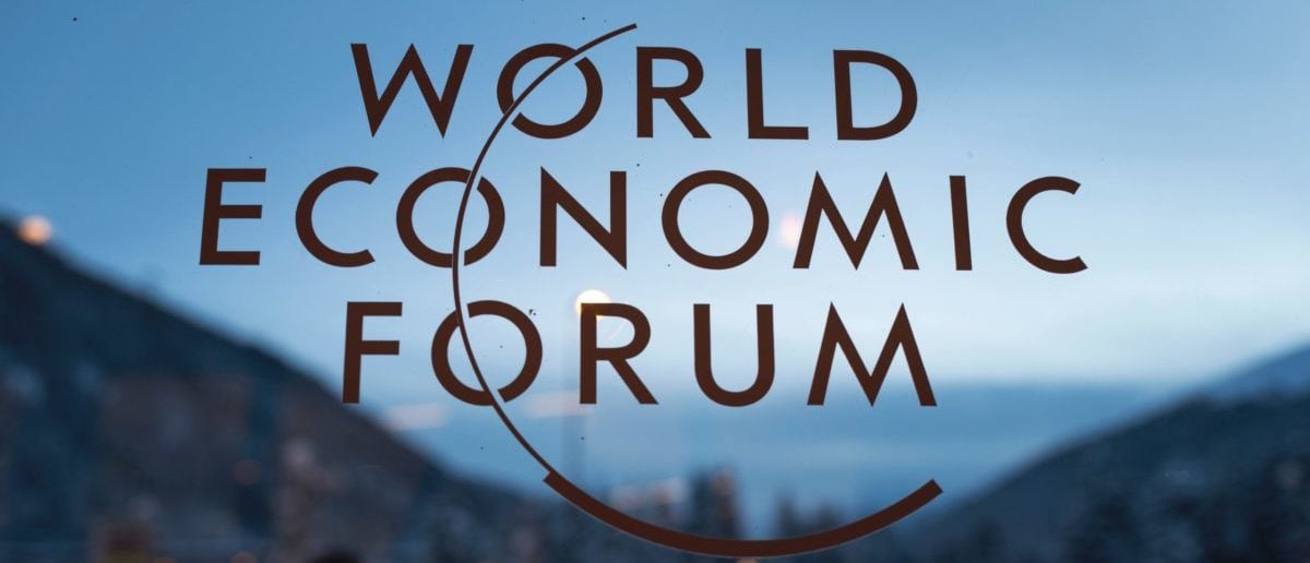 The logo of the World Economic Forum (WEF) is seen on window pane at the Congress Center prior to the forum's annual meeting in Davos on January 18, 2016. More than 40 heads of states and governments will attend the WEF in Davos, which this year is focused on "mastering the fourth Industrial Revolution," organisers said. / AFP / FABRICE COFFRINI (Photo credit should read FABRICE COFFRINI/AFP via Getty Images)