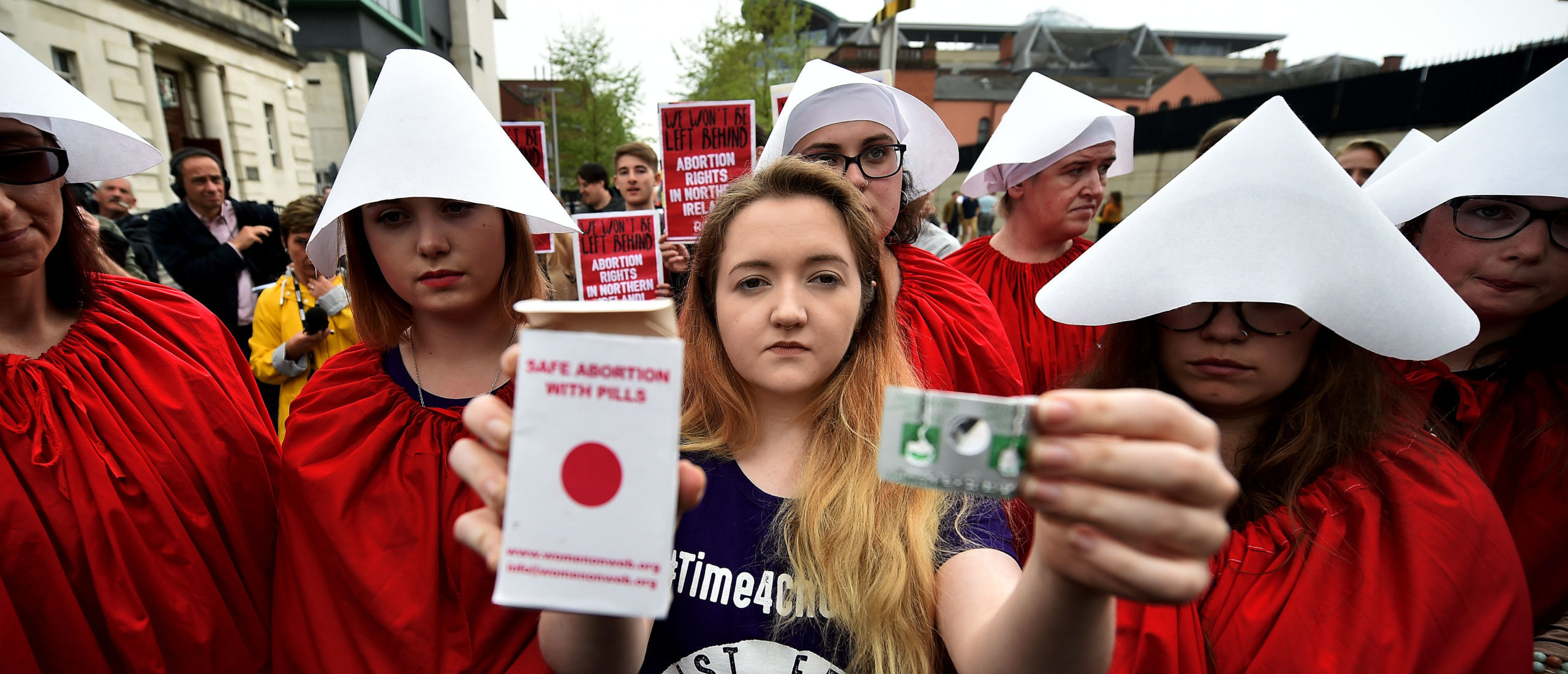 BELFAST, NORTHERN IRELAND - MAY 31: Eleanor Crossey Malone displays an abortion pill packet after taking a pill as abortion rights campaign group ROSA, Reproductive Rights Against Oppression, Sexism and Austerity distribute abortion pills from a touring bus on May 31, 2018 in Belfast, Northern Ireland. (Photo by Charles McQuillan/Getty