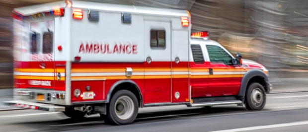 Ambulance driving [Shutterstock blurAZ]