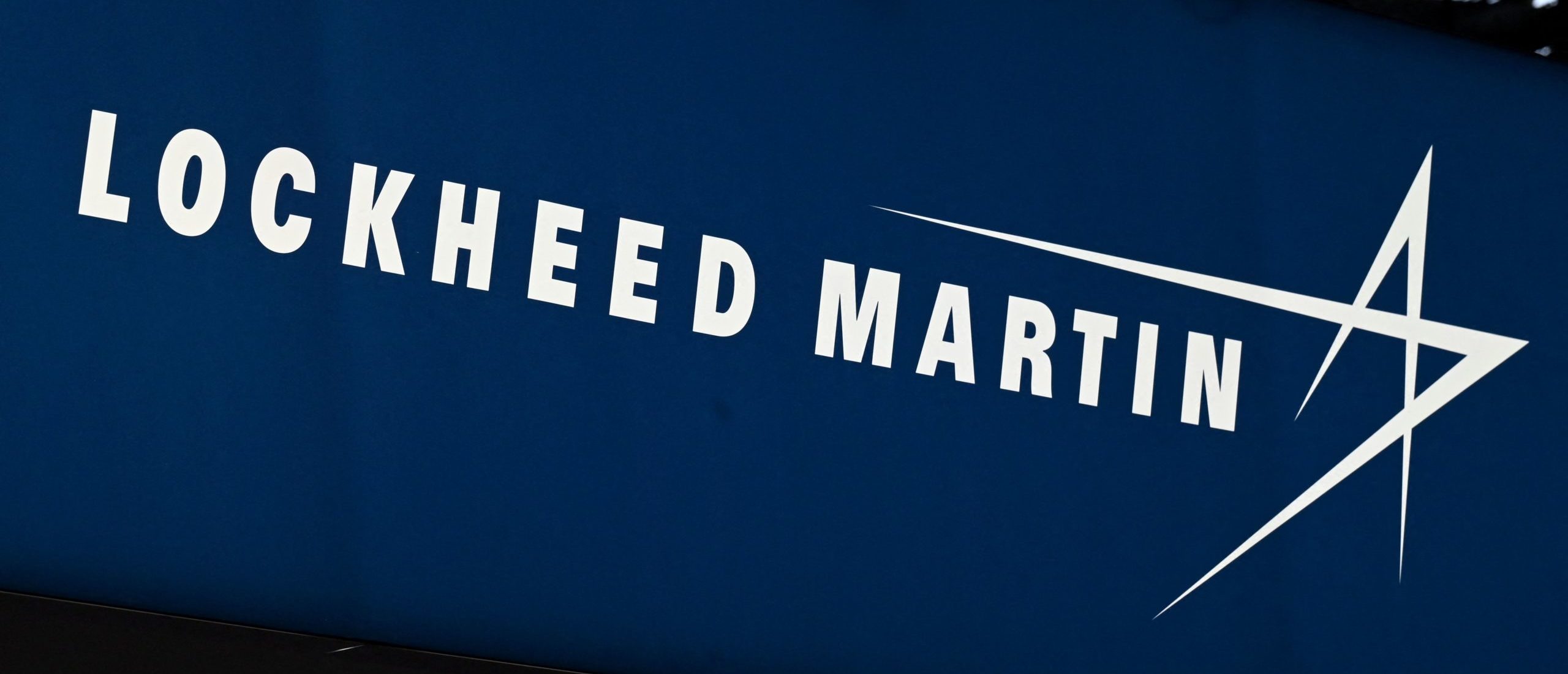 This photograph taken on June 13, 2022, shows the logo from US defence manufacturer Lockheed Martin on display at the Eurosatory international land and airland defence and security trade fair, in Villepinte, a northern suburb of Paris. (Photo by EMMANUEL DUNAND/AFP via Getty Images)