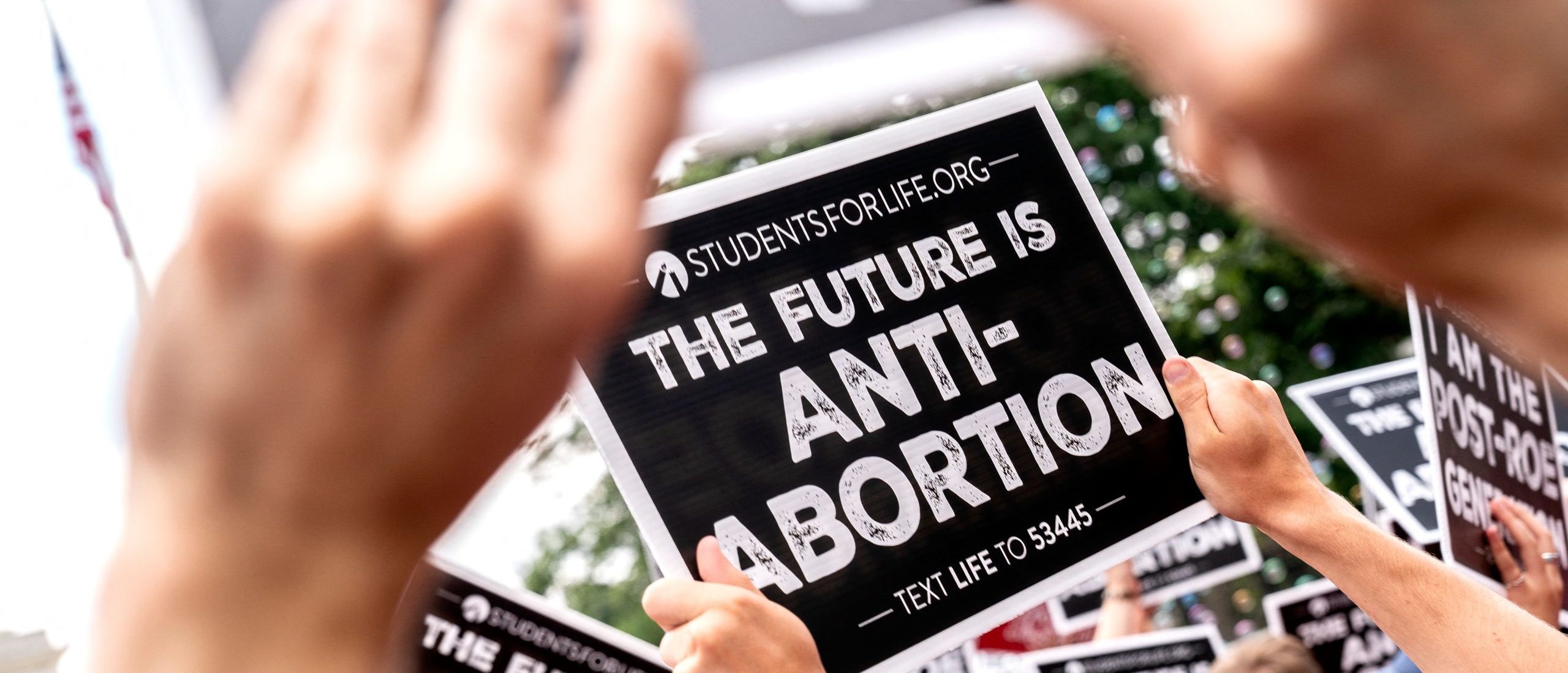 Anit-abortion activists hold signs outside the US Supreme Court in Washington, DC, on June 24, 2022.