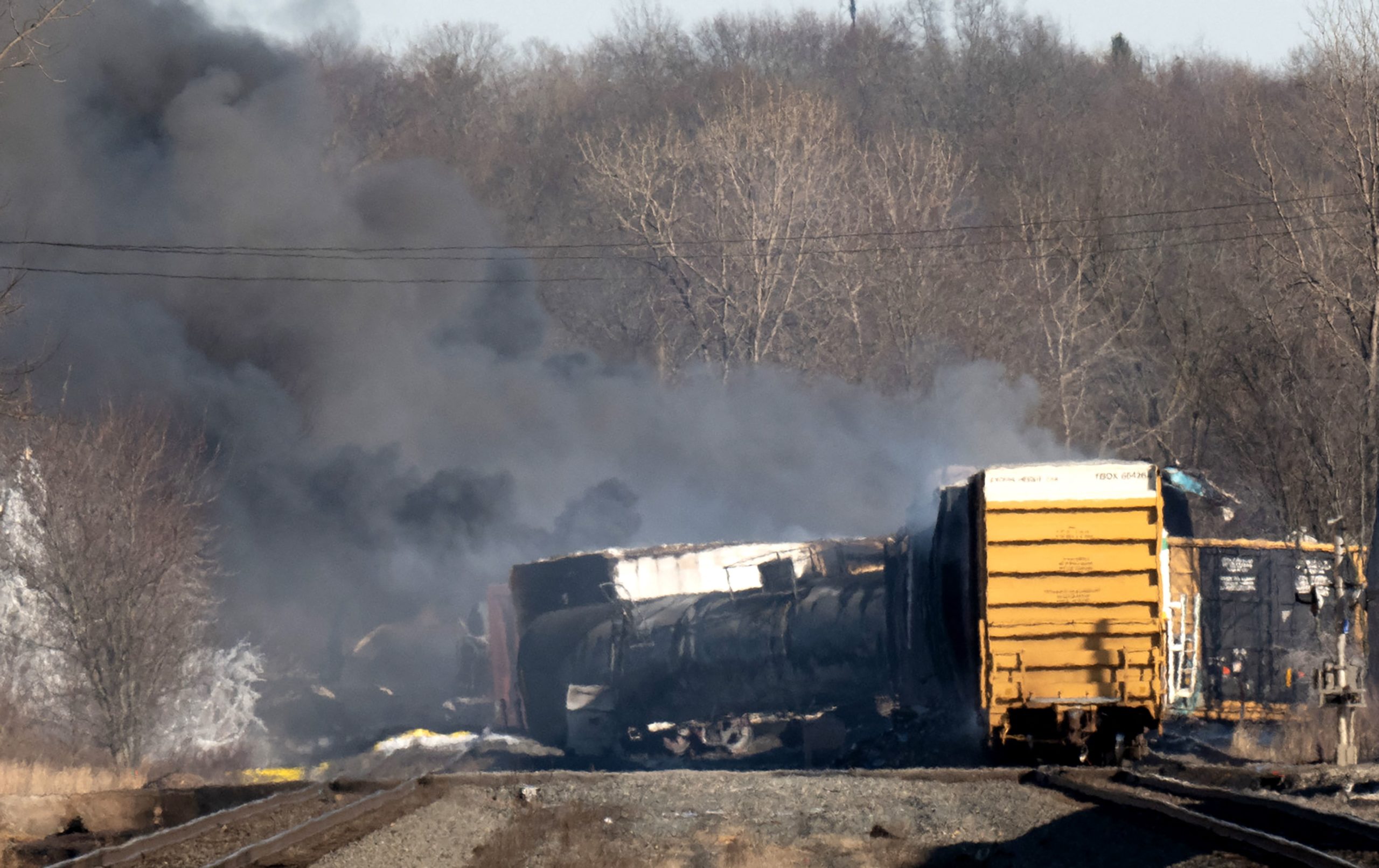 Smoke rises from a derailed cargo train in East Palestine, Ohio, on February 4, 2023.