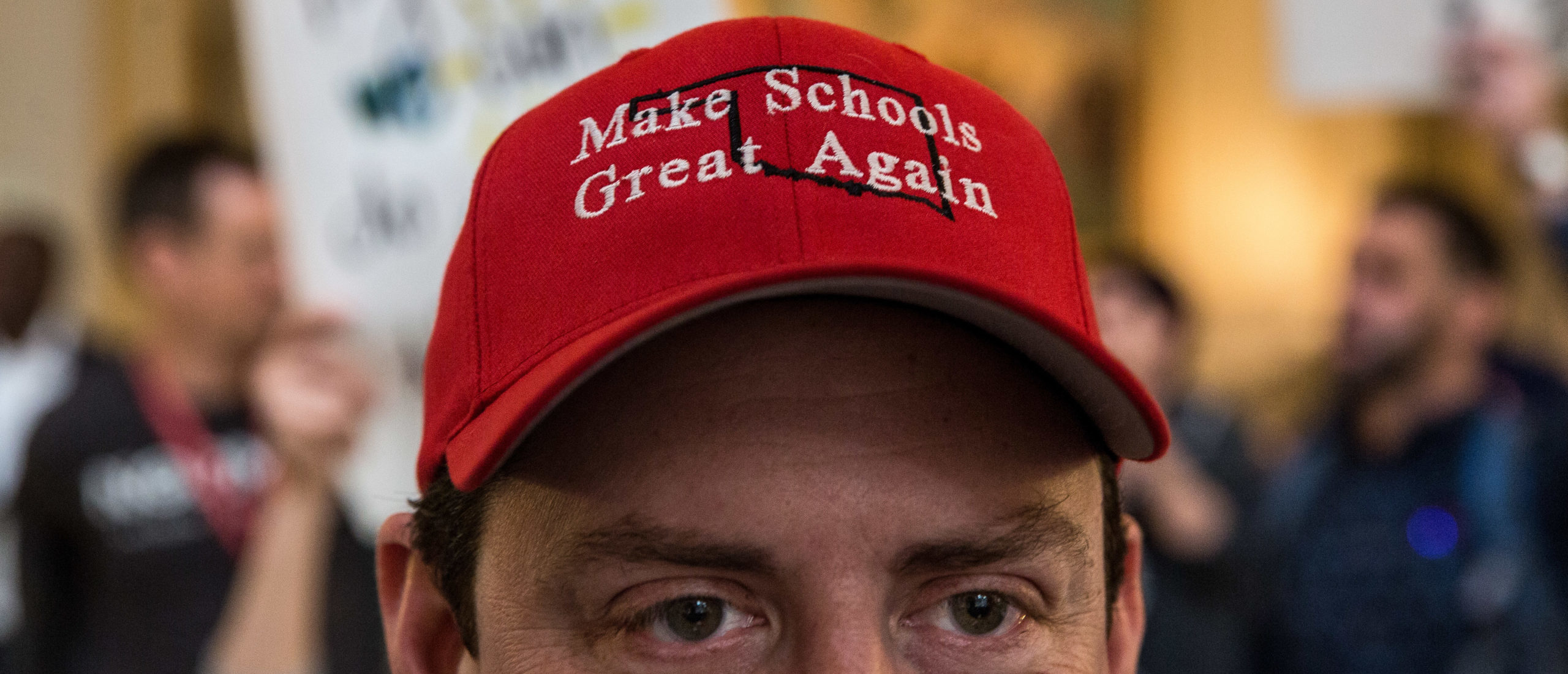 Tahlequah High School band director Josh Allen wore a custom hat at theOklahoma state Capitol building during the third day of a statewide education walkout on April 4, 2018 in Oklahoma City, Oklahoma. Teachers and their supporters are demanding increased school funding and pay raises for school workers. (Photo by Scott Heins/Getty Images)