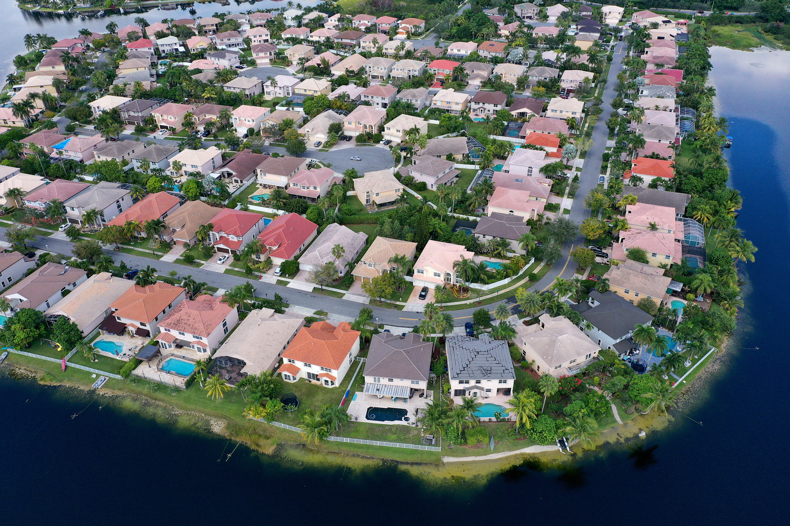 MIRAMAR, FLORIDA - OCTOBER 27: In this aerial view, single family homes are shown in a residential neighborhood on October 27, 2022 in Miramar, Florida. The rate on the average 30-year fixed mortgage hit 7.08%, up from 6.94% the week prior, according to Freddie Mac. Mortgage rates surpassed 7% for the first time since April 2002. (Photo by Joe Raedle/Getty Images)