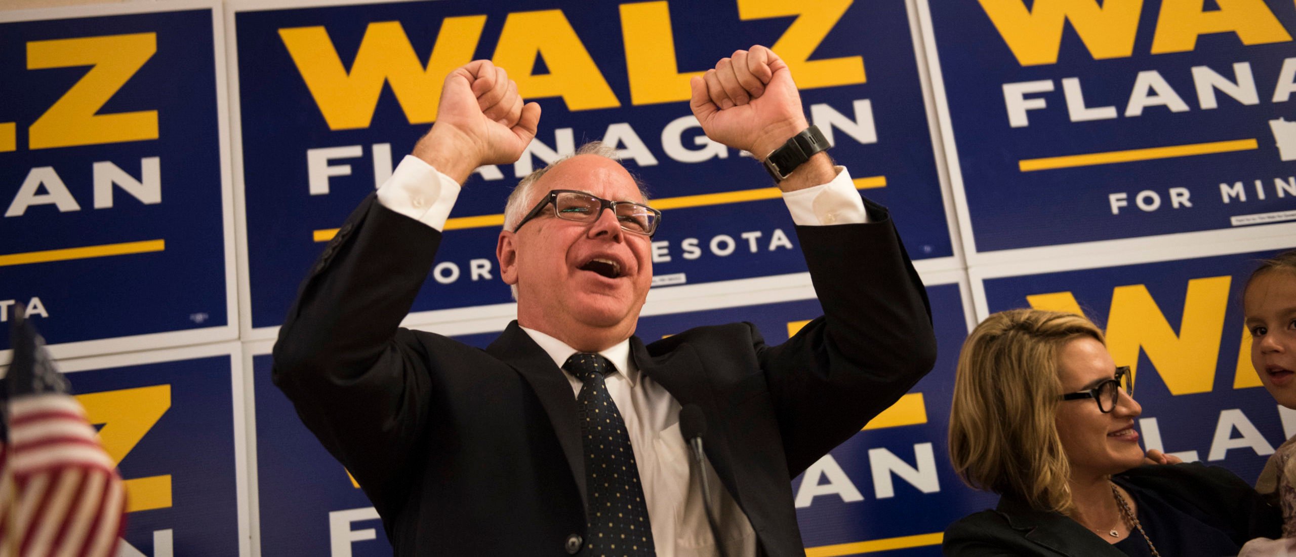 Rep. Tim Walz (D-MN) takes the stage with running mate Peggy Flanagan and their families in front of a crowd of supporters at his election night party on August 14, 2018 in St Paul, Minnesota.