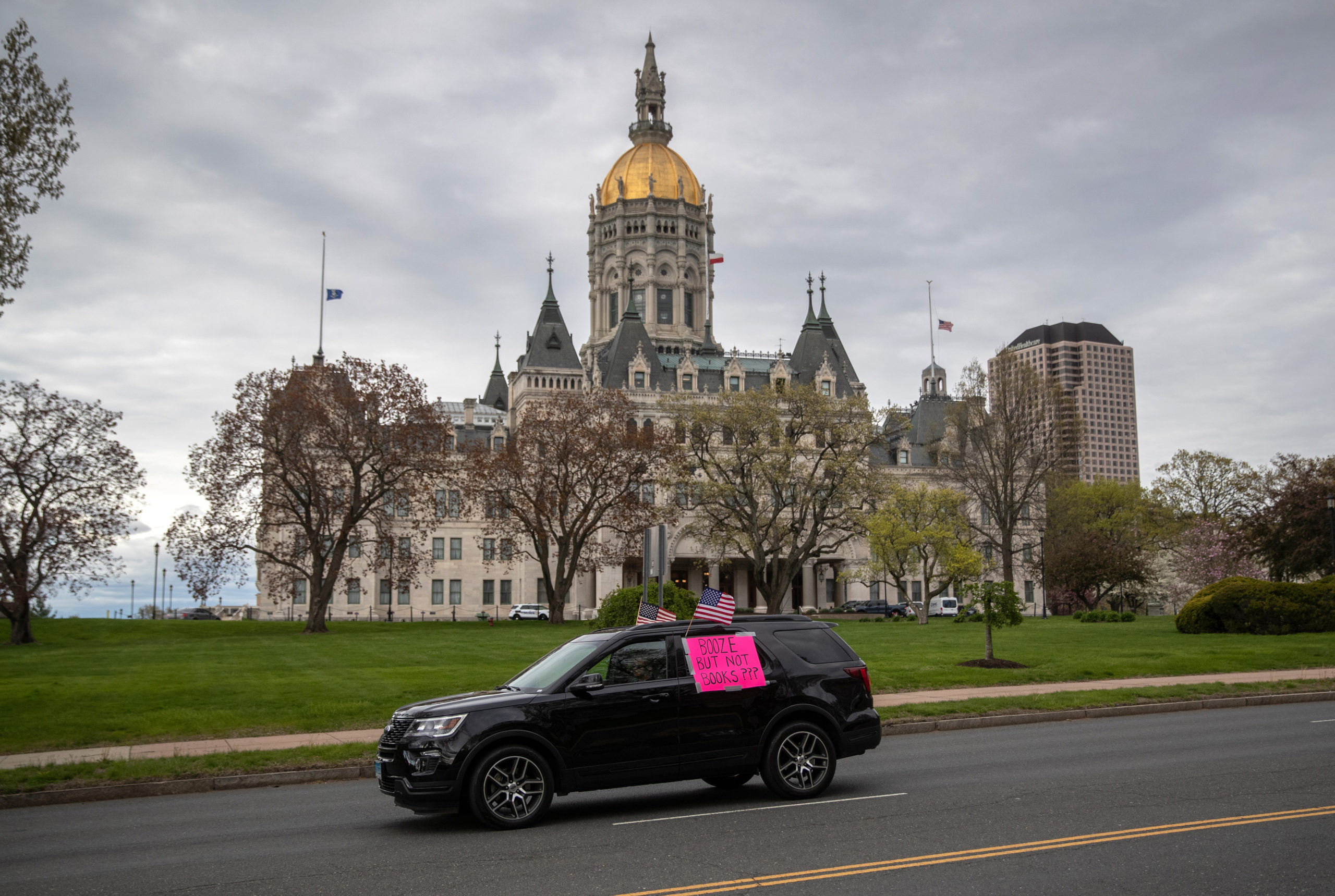 HARTFORD, CONNECTICUT - MAY 04: Demonstrators hold a "Rolling Car Rally" against Democratic Governor Ned Lamont's stay-at-home order to combat the coronavirus (COVID-19) pandemic on May 04, 2020 in Hartford, Connecticut. About a hundred vehicles drove around the state capital building and then the governor's mansion, displaying flags and signs. (Photo by John Moore/Getty Images)