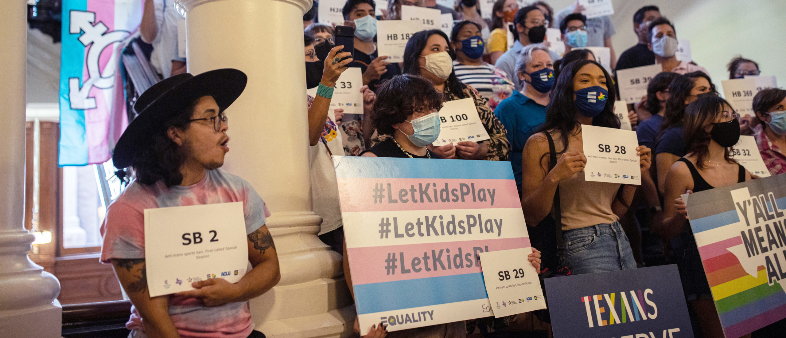 AUSTIN, TX - SEPTEMBER 20: LGBTQ rights supporters gather at the Texas State Capitol to protest state Republican-led efforts to pass legislation that would restrict the participation of transgender student athletes on the first day of the 87th Legislature's third special session on September 20, 2021 in Austin, Texas. (Photo by Tamir Kalifa/Getty Images)