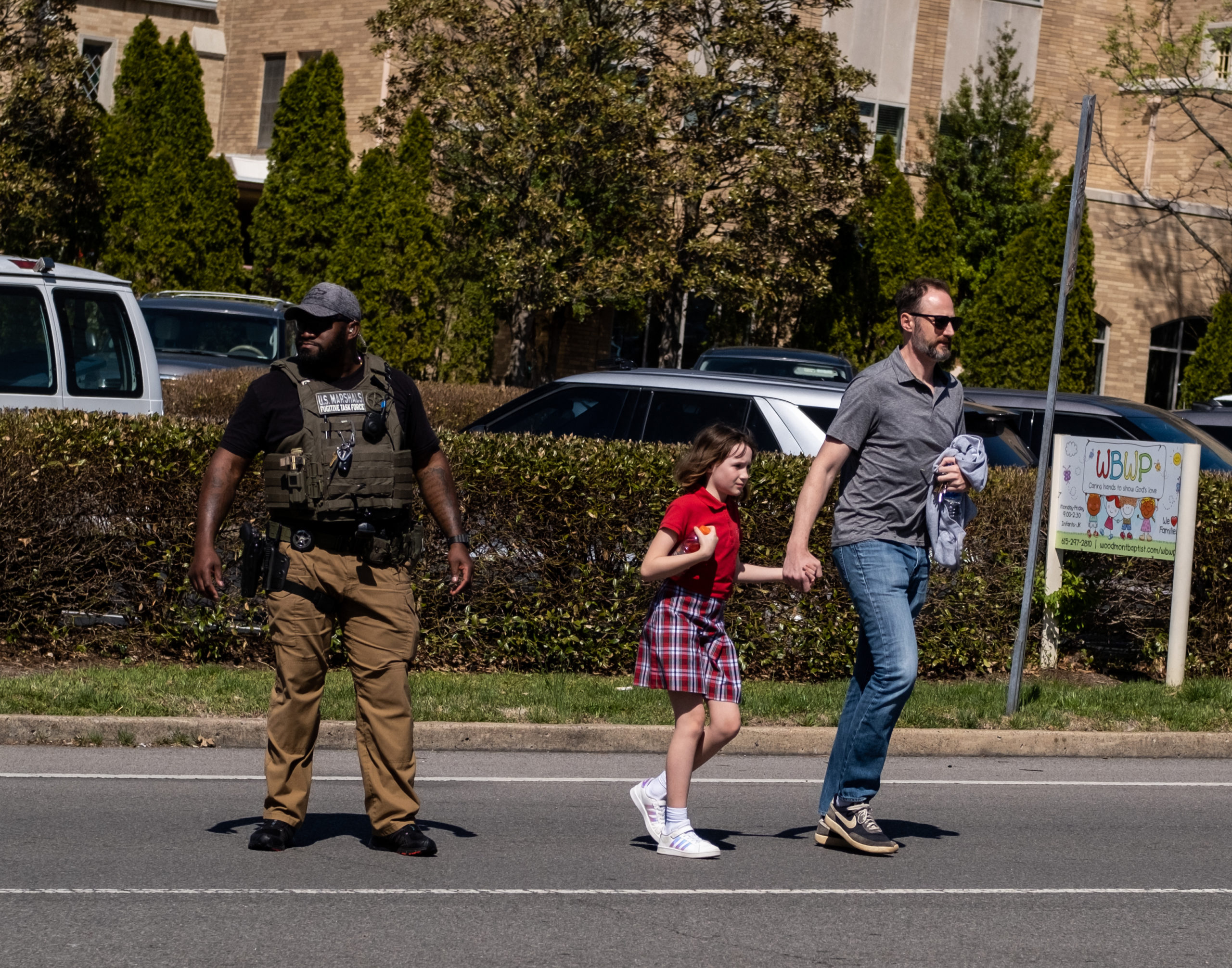 A parent walks with their child from Woodmont Baptist Church where children were reunited with their families after a mass shooting at The Covenant School on March 27, 2023 in Nashville, Tennessee. According to initial reports, three students and three adults were killed by the shooter, a 28-year-old woman. The shooter was killed by police responding to the scene. (Photo by Seth Herald/Getty Images)