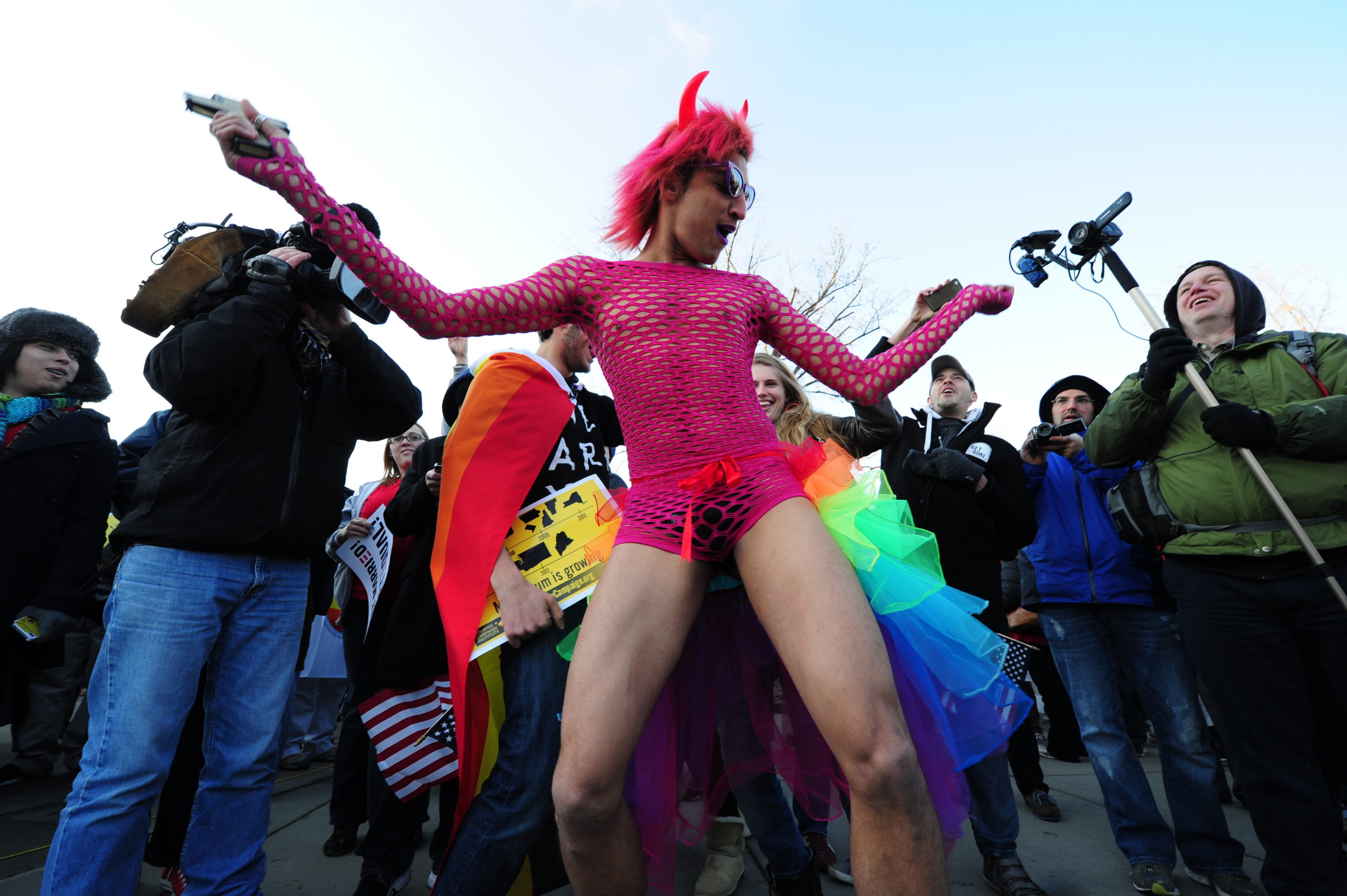 A man dressed in drag known as "Queen", from Florida, dances in front of the US Supreme Court on March 26, 2013 in Washington, DC. The Supreme Court, for the first time, takes up the delicate and divisive issue of gay marriage when the nine justices consider the legality of a California ballot initiative that limits marriage to opposite-sex couples.Tuesday will be the first of two days of oral arguments on the issue. On Wednesday, the court will consider the 1996 federal Defense of Marriage Act (DOMA), which limits the definition of marriage to opposite-sex couples. AFP PHOTO/Karen BLEIER (Photo credit should read KAREN BLEIER/AFP via Getty Images)