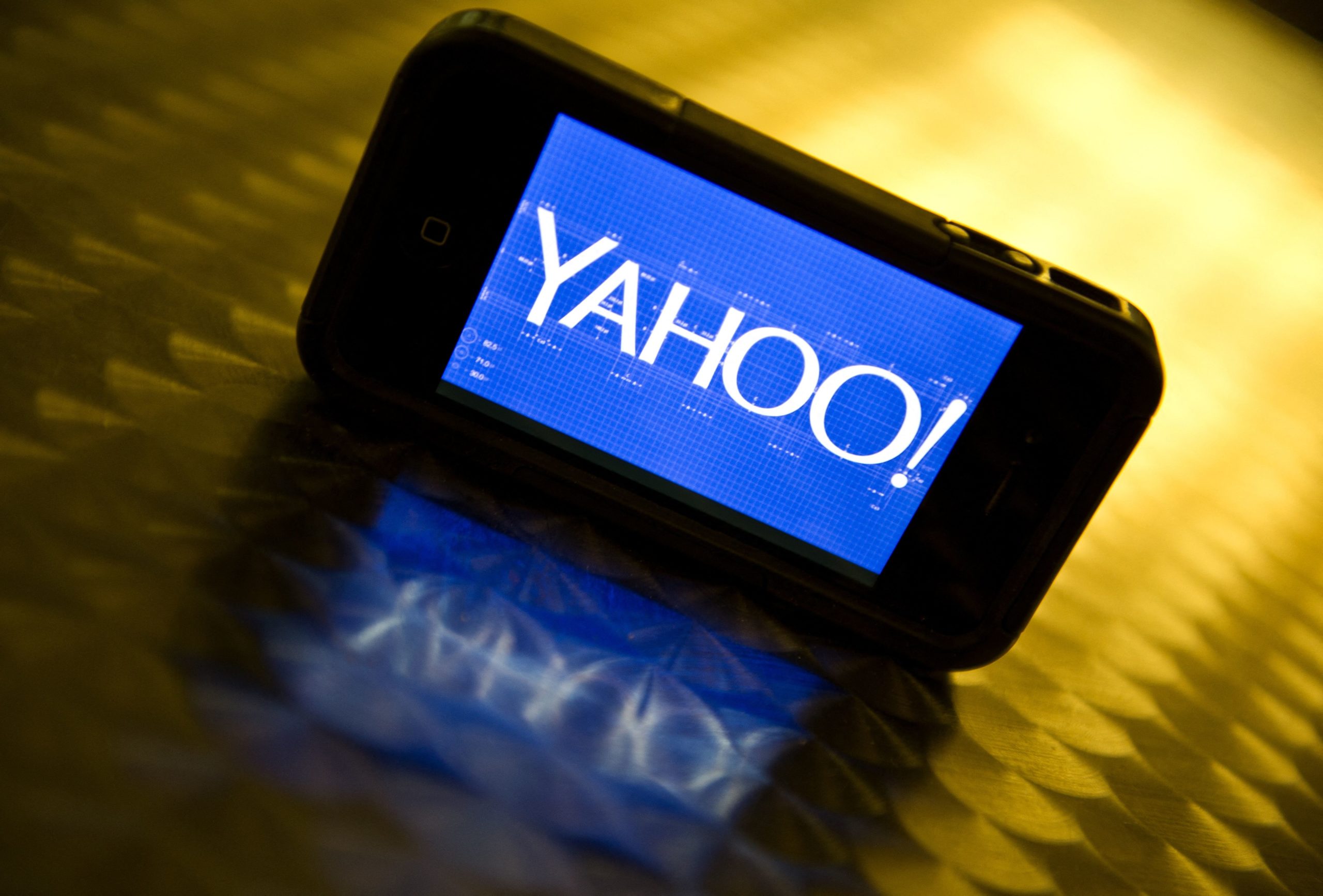 This September 12, 2013 photo illustration shows the newly designed Yahoo logo seen on a smartphone. Yahoo has refreshed its logo for the first time since the Internet companys founding 18 years ago. The new look unveiled September 4 is part of a makeover that Yahoo Inc. has been undergoing since the Sunnyvale, California company hired Google executive Marissa Mayer to become Yahoos CEO. 