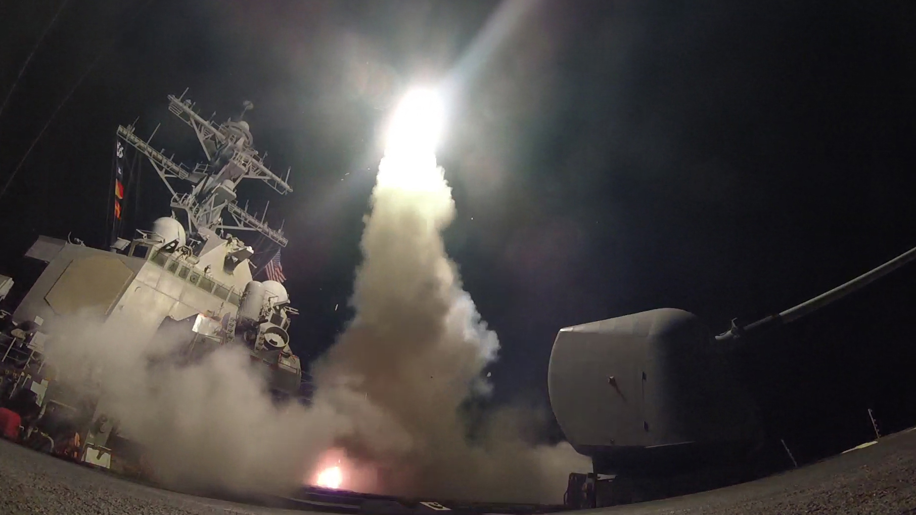 MEDITERRANEAN SEA - APRIL 7: In this handout provided by the U.S. Navy,The guided-missile destroyer USS Porter fires a Tomahawk land attack missile on April 7, 2017 in the Mediterranean Sea. The USS Porter was one of two destroyers that fired a total of 59 cruise missiles at a Syrian military airfield in retaliation for a chemical attack that killed scores of civilians this week. The attack was the first direct U.S. assault on Syria and the government of President Bashar al-Assad in the six-year war there. 