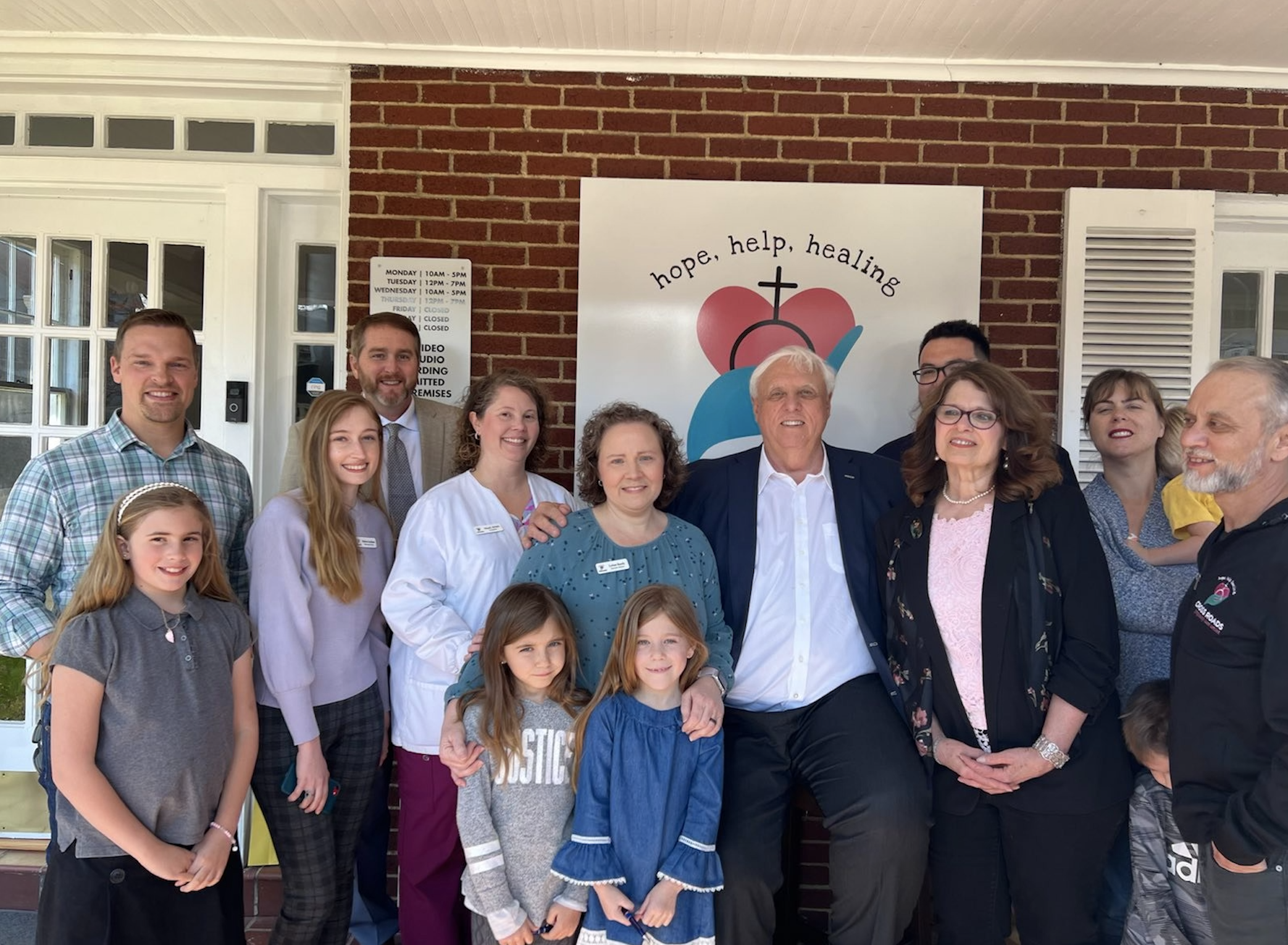 Governor Jim Justice posses with staff from Cross Roads Crisis Pregnancy Center in West Virginia during a signing ceremony for HB 2002 | SBA Pro Life America