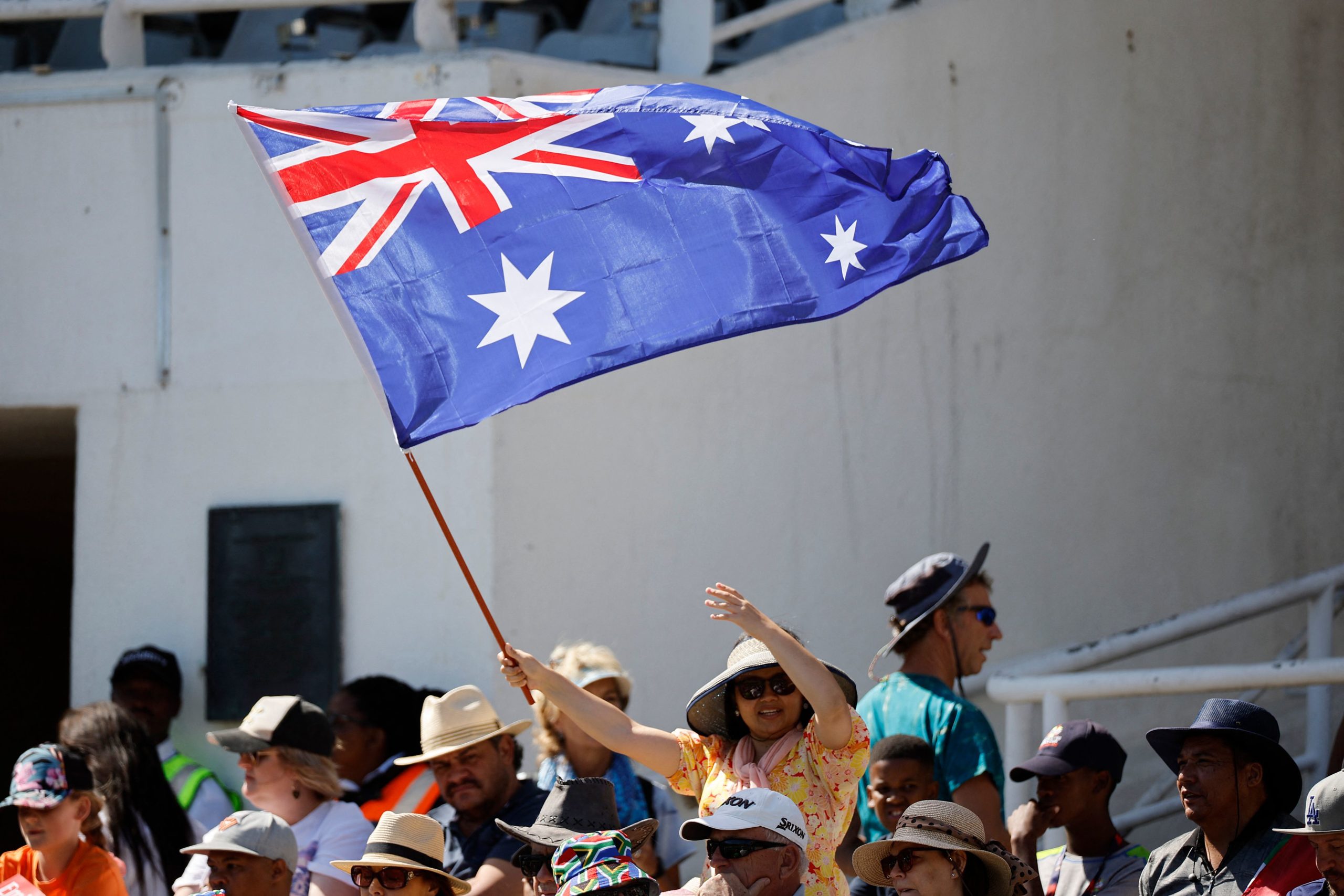 An Australian supporter waves the Australia flag during the final T20 women's World Cup cricket match between South Africa and Australia at Newlands Stadium in Cape Town on February 26, 2023. (Photo by Marco Longari / AFP) (Photo by MARCO LONGARI/AFP via Getty Images)
