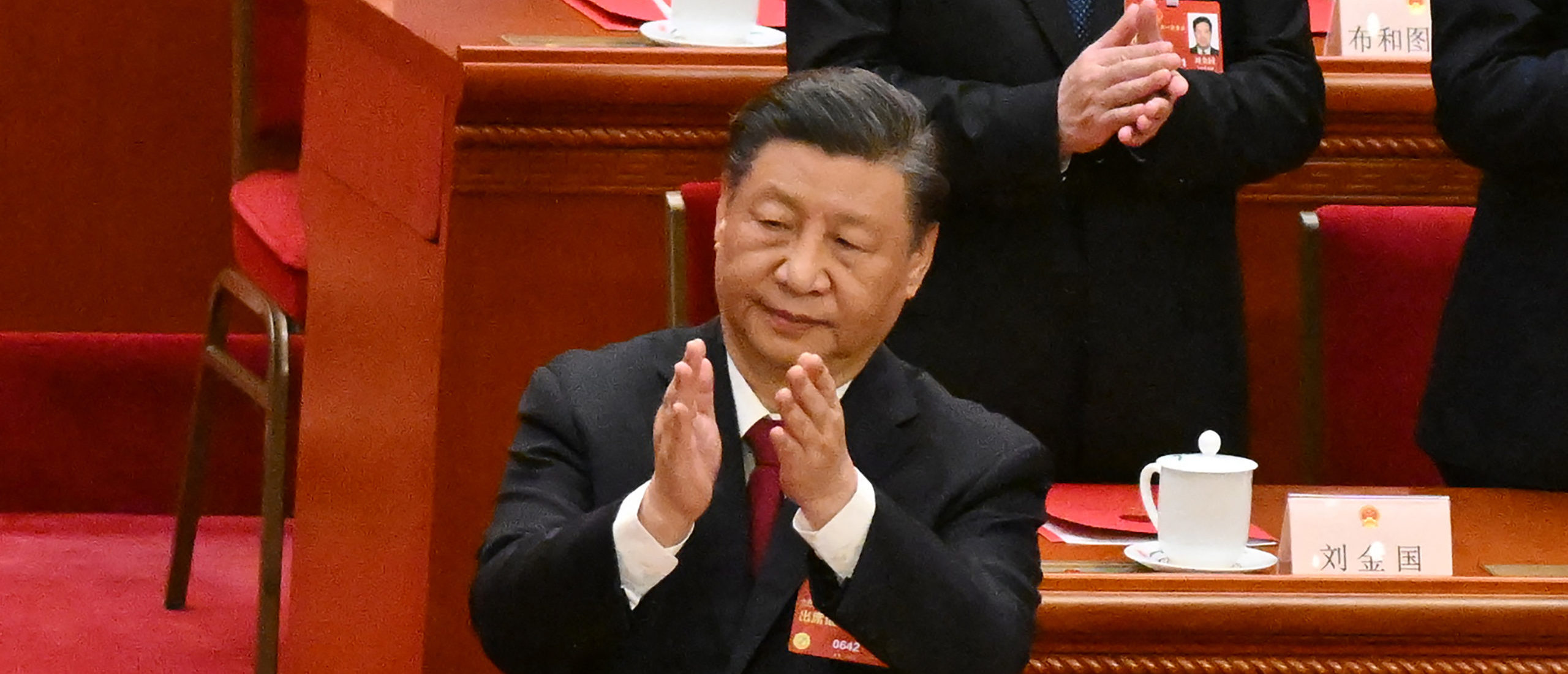China's President Xi Jinping applauds after the closing session of the National People's Congress (NPC) at the Great Hall of the People in Beijing on March 13, 2023. (Photo by NOEL CELIS/POOL/AFP via Getty Images)