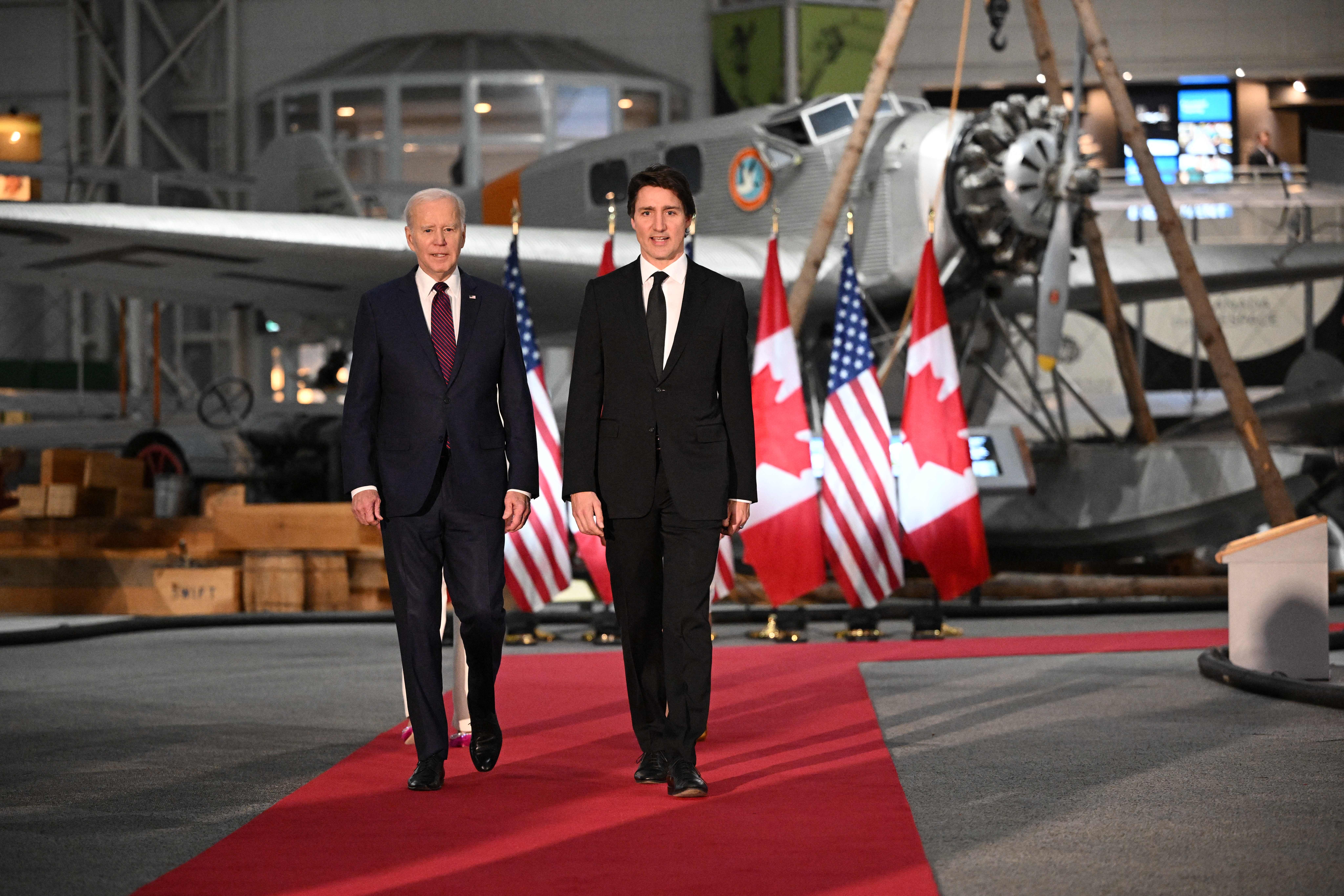 US President Joe Biden and Canada's Prime Minister Justin Trudeau arrive to attend a gala dinner hosted Justin Trudeau and his wife Sophie Gregoire Trudeau at the Canadian Aviation and Space Museum in Ottawa, Canada, on March 24, 2023. 