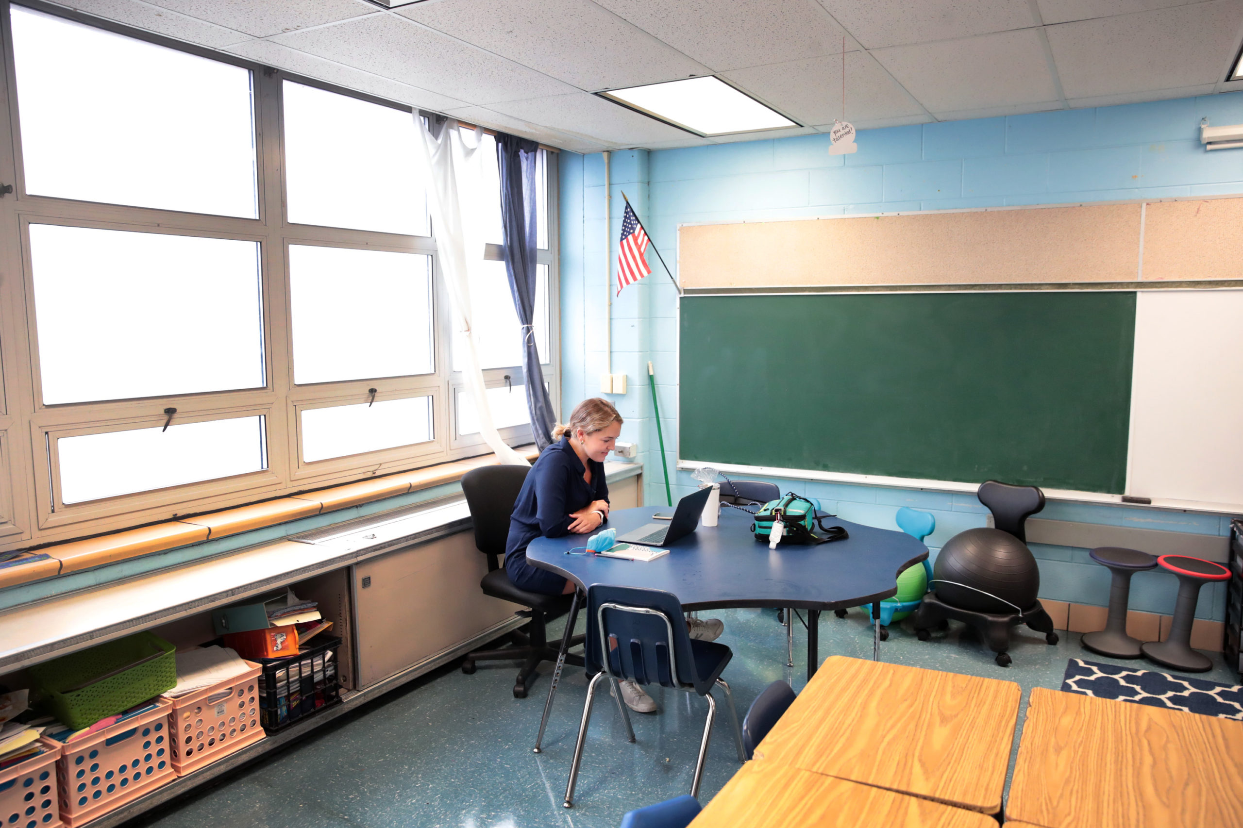 Lucy Baldwin, a teacher at King Elementary School, sits in an empty classroom teaching her students remotely during the first day of classes on September 08, 2020 in Chicago, Illinois. Students at King Elementary and the rest of Chicago public schools started classes today with students being taught remotely because of COVID-19 concerns. Teachers are given the option to teach from home or from their classrooms. (Photo by Scott Olson/Getty Images)