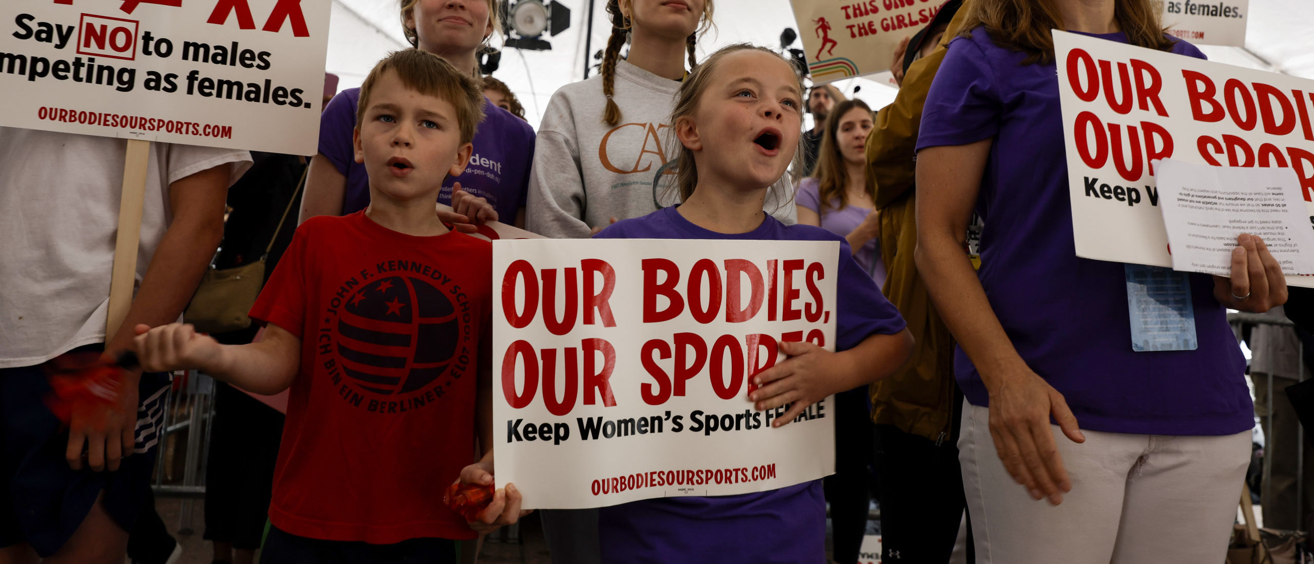 Demonstrators cheer during the speaking program at the "Our Bodies, Our Sports" rally for the 50th anniversary of Title IX at Freedom Plaza on June 23, 2022 in Washington, DC.