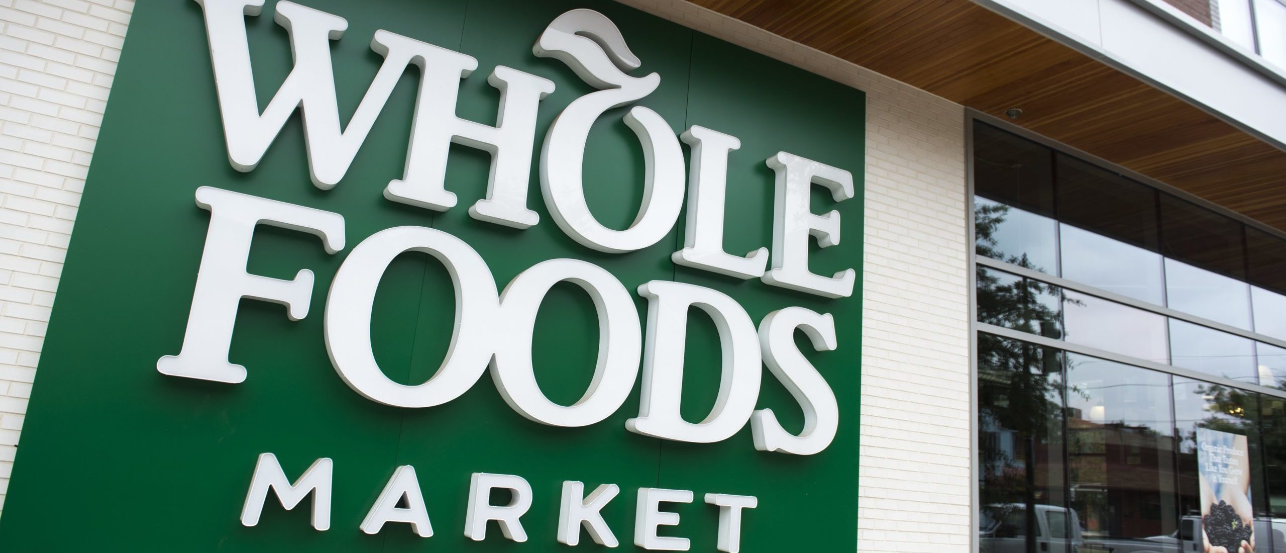 A Whole Foods Market sign is seen in Washington, DC, June 16, 2017, following the announcement that Amazon would purchase the supermarket chain for $13.7 billion. - Amazon is once again shaking up the retail sector, with the announcement it will acquire upscale US grocer Whole Foods Market, known for its pricey organic options, in a deal that underscores the online giant's growing influence in the economy.
