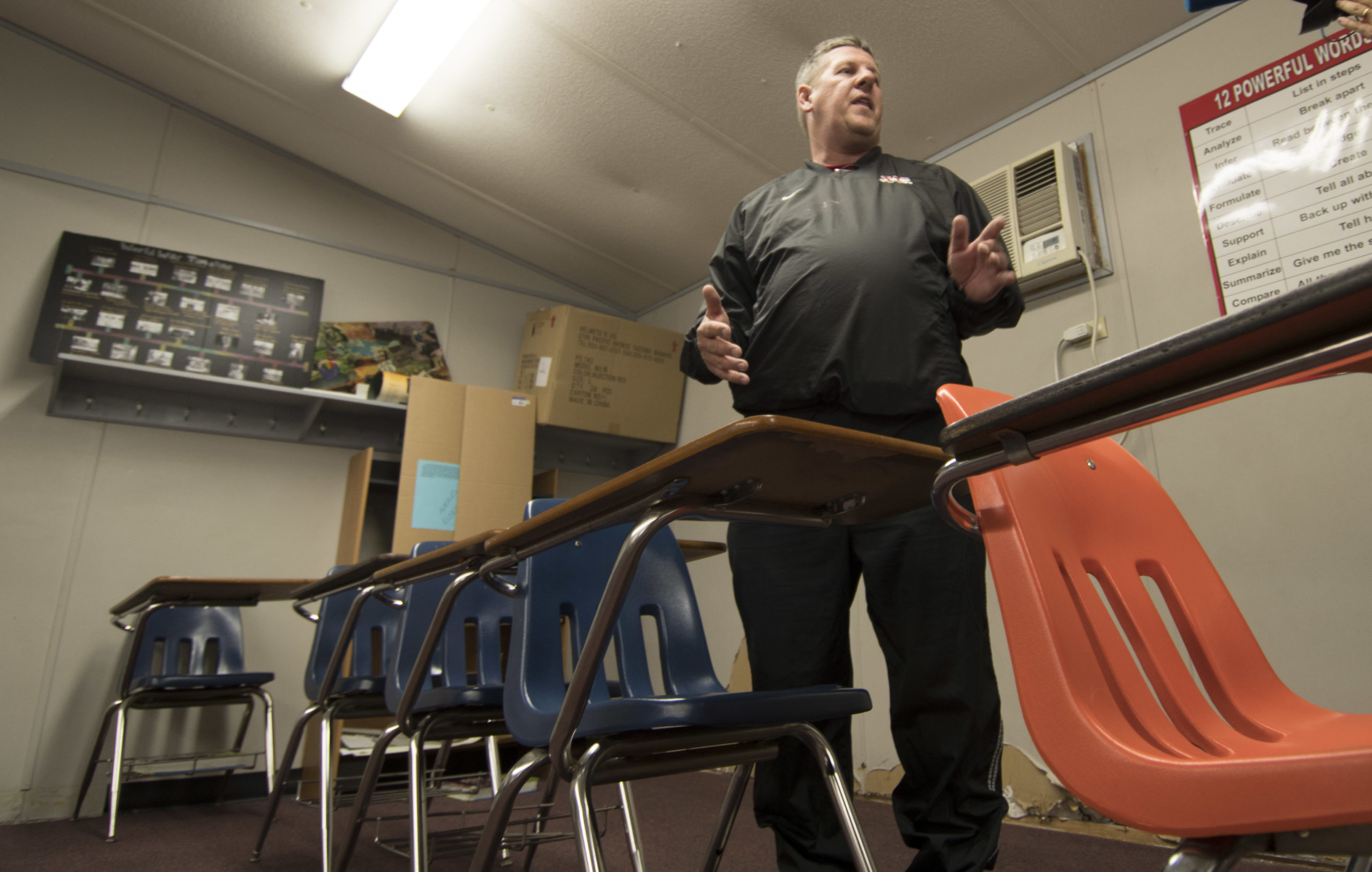 Scott Teel talks about his classroom in a portable building in Moore, Oklahoma on April 4, 2018. Buoyed by a nine-day strike in West Virginia which led to a five percent pay raise, teachers have also walked off the job in Oklahoma and Kentucky and are threatening to do the same in Arizona. Teel pointed to lawmakers as the source of the problem, saying there has been a "lack of vision about education from the state legislature." Teel teaches history using 10-year-old books in a prefabricated trailer with peeling paint. There is no budget for a photocopier or staplers and Teel said parents and teachers dip into their pockets to provide supplies. / AFP PHOTO / J Pat Carter (Photo credit should read J PAT CARTER/AFP via Getty Images)