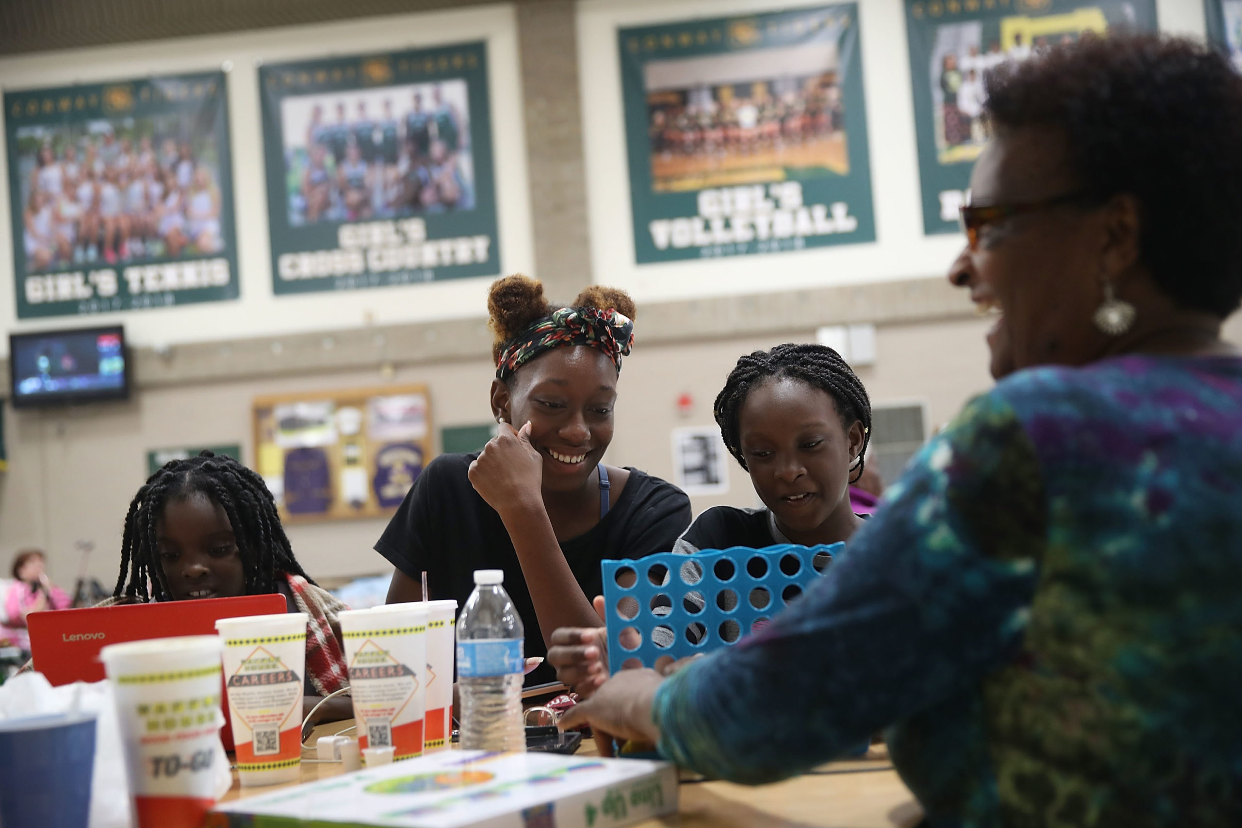 Deonna Moody, Janice Moody, Shaylene Moody and Diane Moody (L-R) wait in an evacuation shelter setup at the Conway High School for the arrival of Hurricane Florence on September 13, 2018 in Conway, United States. Hurricane Florence is expected to arrive on Friday possibly as a category 2 storm along the North Carolina and South Carolina coastline. (Photo by Joe Raedle/Getty Images)