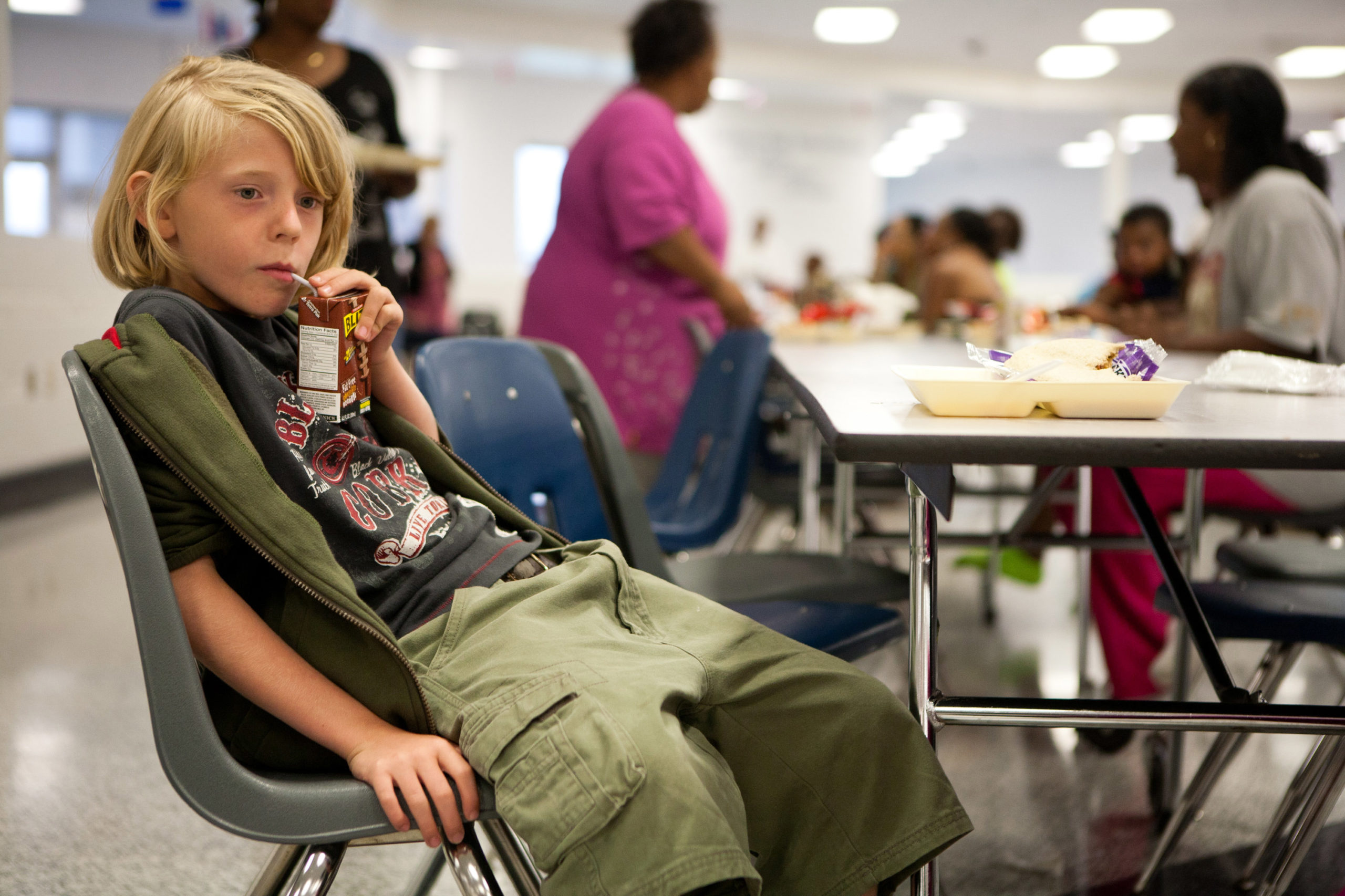 David James, 9, of Virginia Beach, drinks chocolate milk in a shelter for Hurricane Irene at Landstown High School on August 27, 2011 in Virginia Beach, Virginia. The Category 1 storm made landfall in North Carolina early Saturday morning. (Photo by Brendan Hoffman/Getty Images)