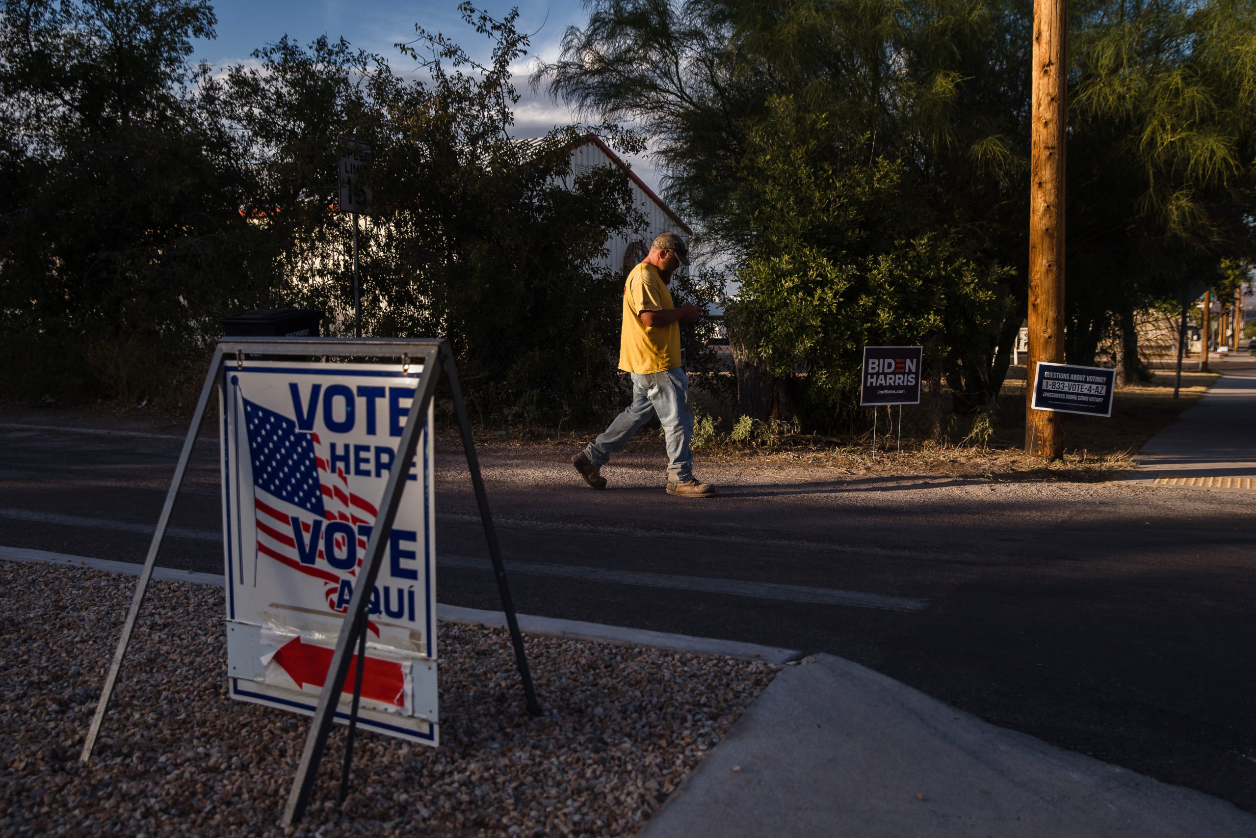 A man leaves a polling station at the Benson School District Board Room in Benson, Arizona, on November 3, 2020. - The US started voting Tuesday in an election amounting to a referendum on Donald Trump's uniquely brash and bruising presidency, which Democratic opponent and frontrunner Joe Biden urged Americans to end to restore "our democracy." (Photo by ARIANA DREHSLER / AFP) (Photo by ARIANA DREHSLER/AFP via Getty Images)